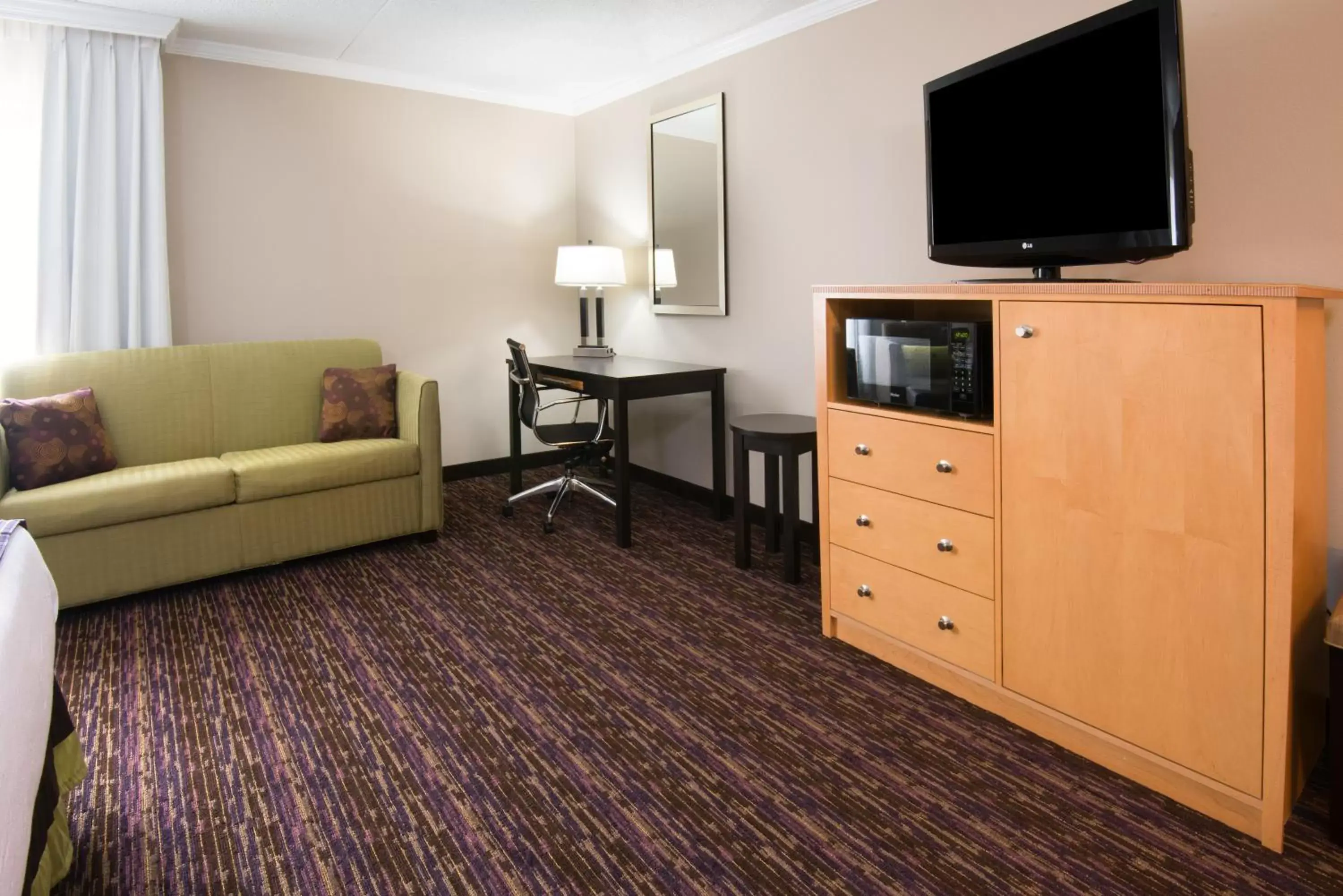 Photo of the whole room, TV/Entertainment Center in Holiday Inn Williamsport, an IHG Hotel