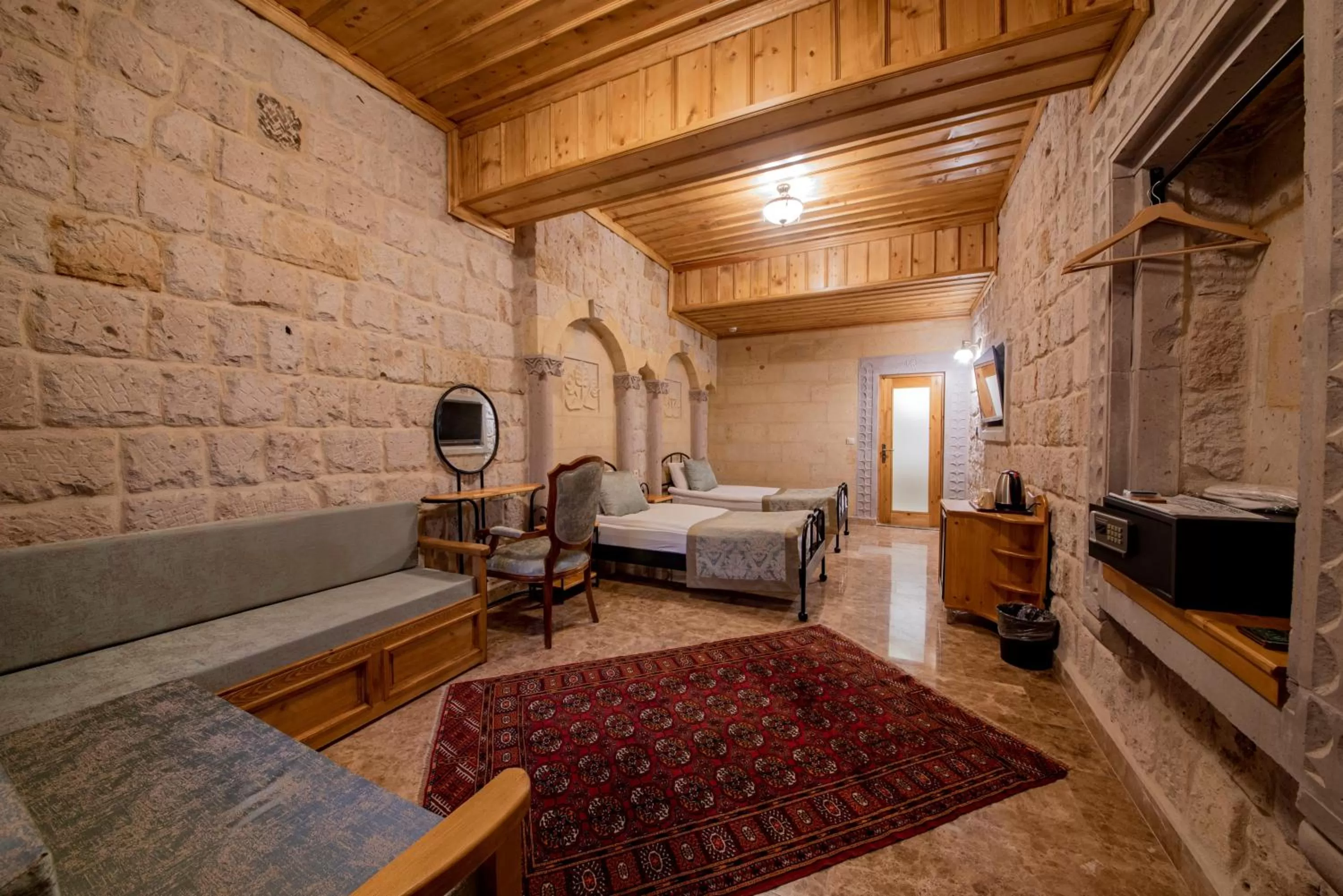 Seating area, Bed in Cratus Stone Palace