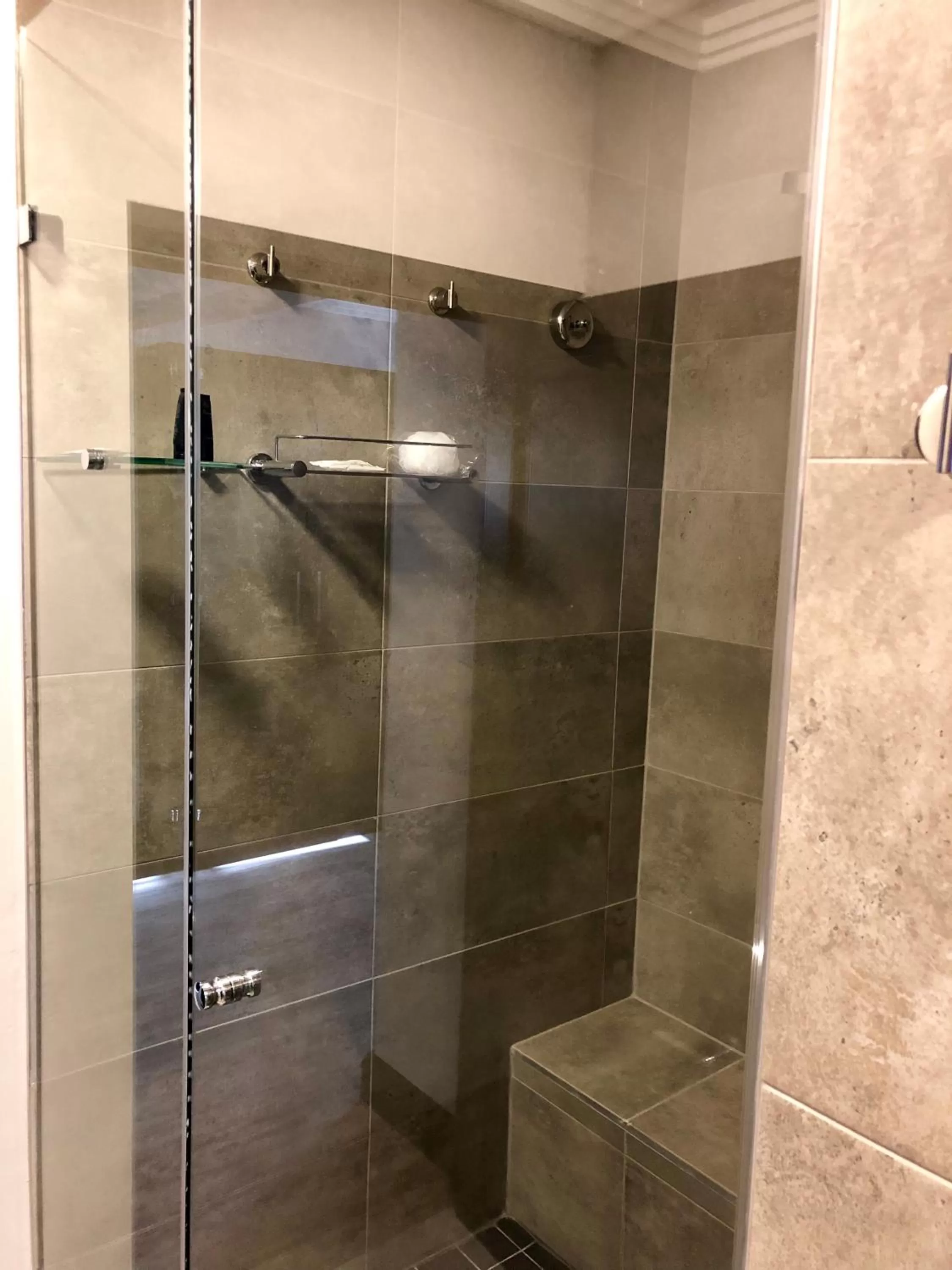 Shower in Belaire Suites Hotel