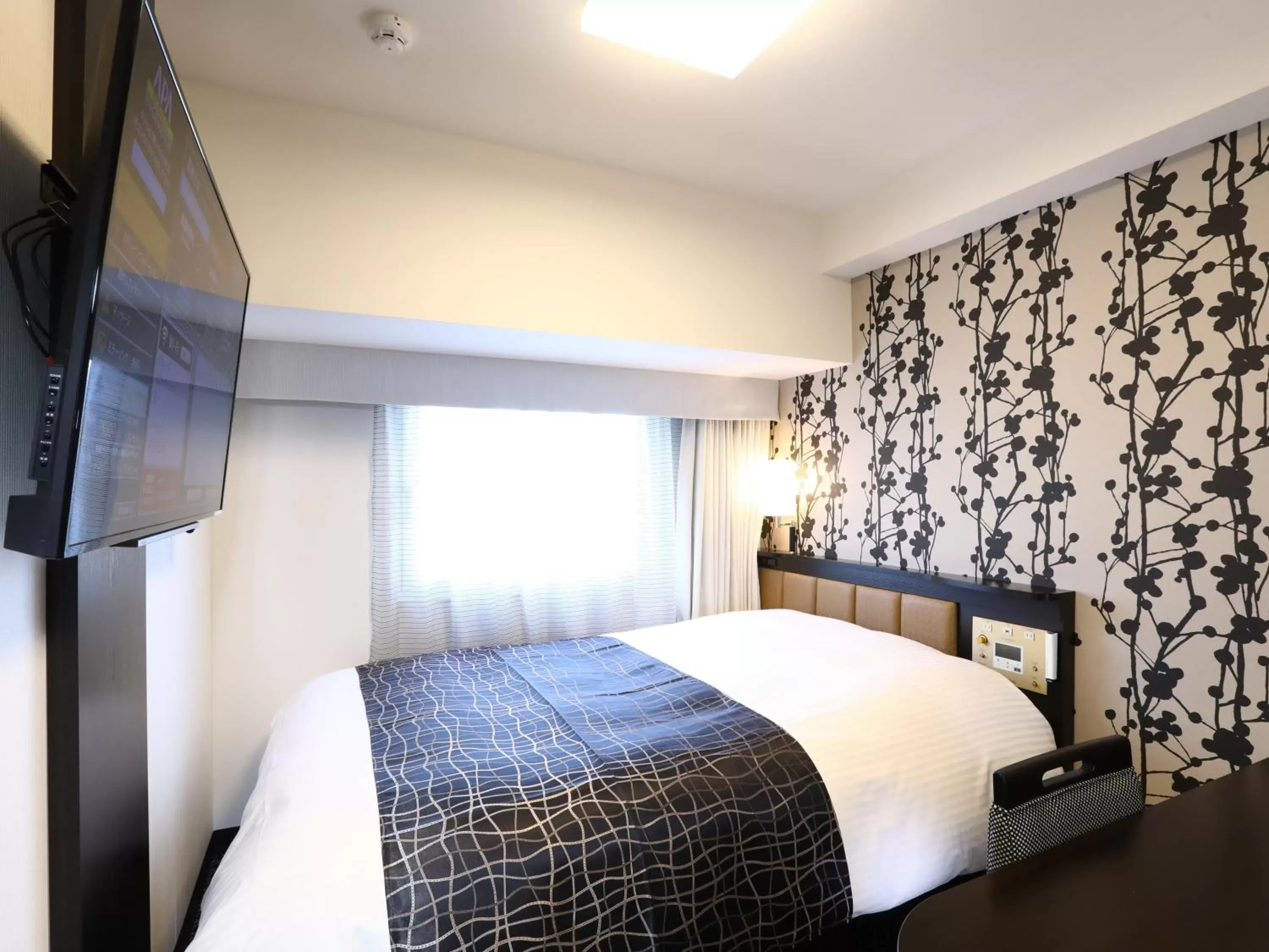 Bed in APA Hotel Yamanote Otsuka Ekimae Tower Bed in APA Hotel Yamanote Otsuka Ekimae Tower