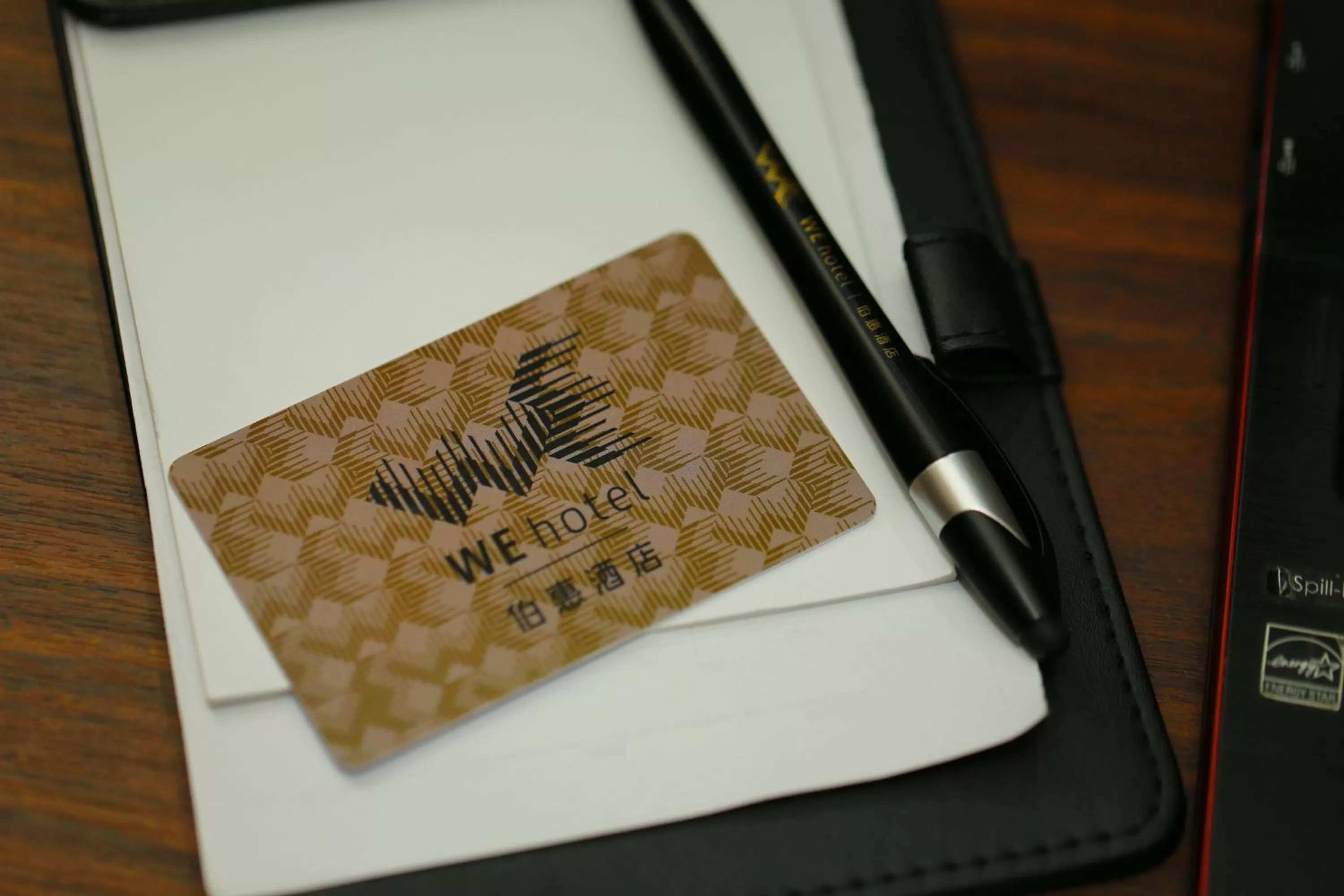 Property logo or sign in WE Hotel