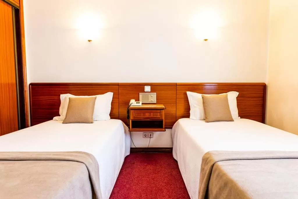 Bed in Dona Amélia Hotel by RIDAN Hotels