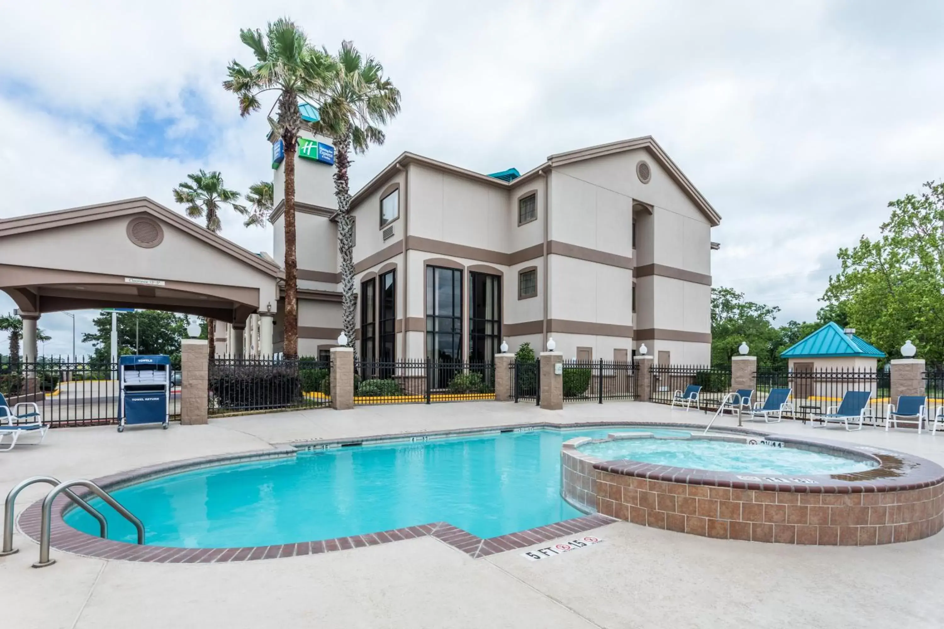 Swimming pool, Property Building in Holiday Inn Express Hotel and Suites Lake Charles, an IHG Hotel