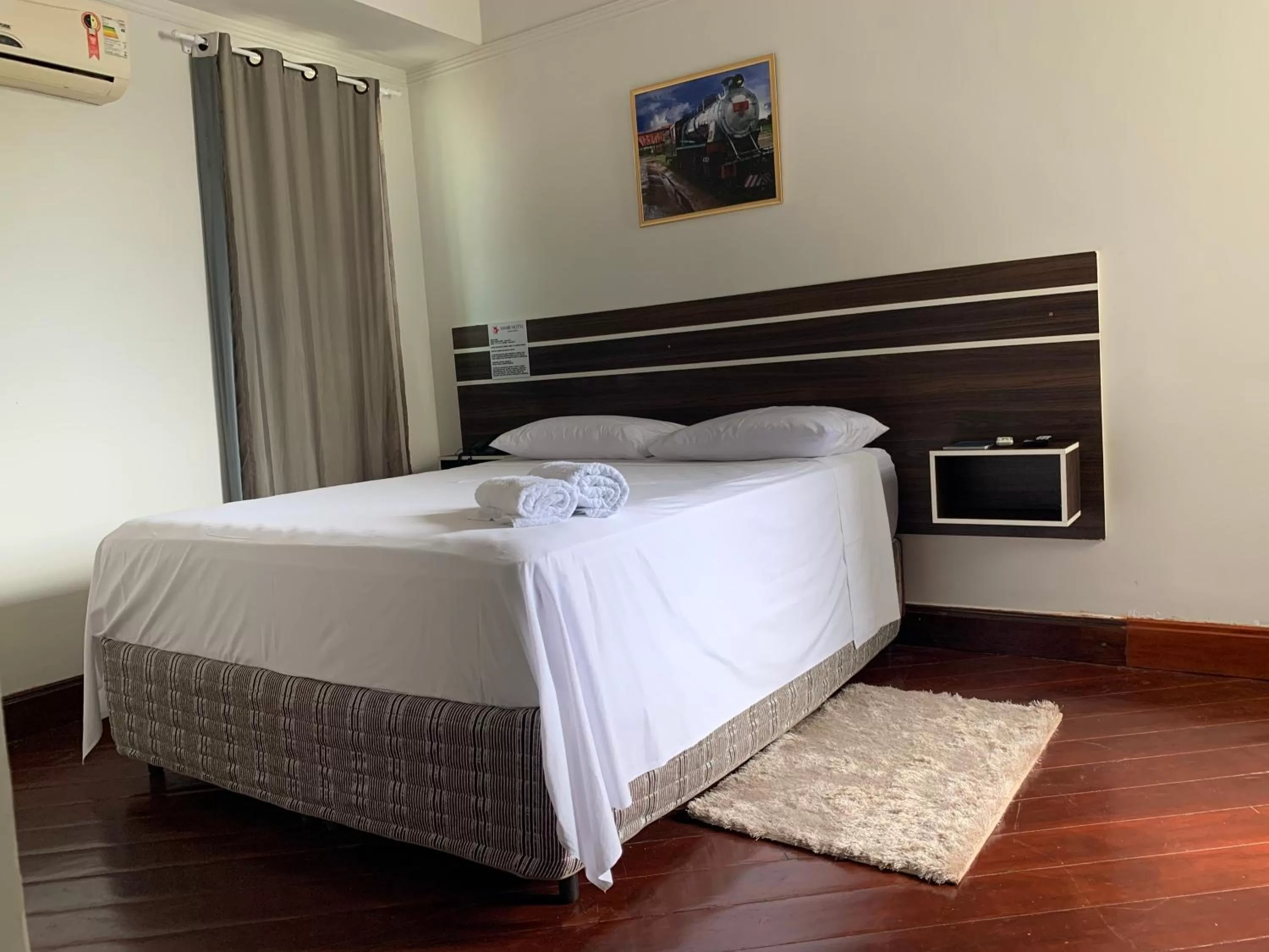 Bed in SAMIR HOTEL COMFORT