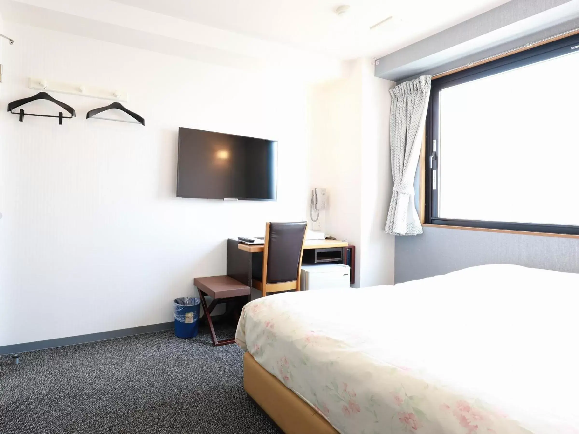 Bed in Toyama Town Hotel