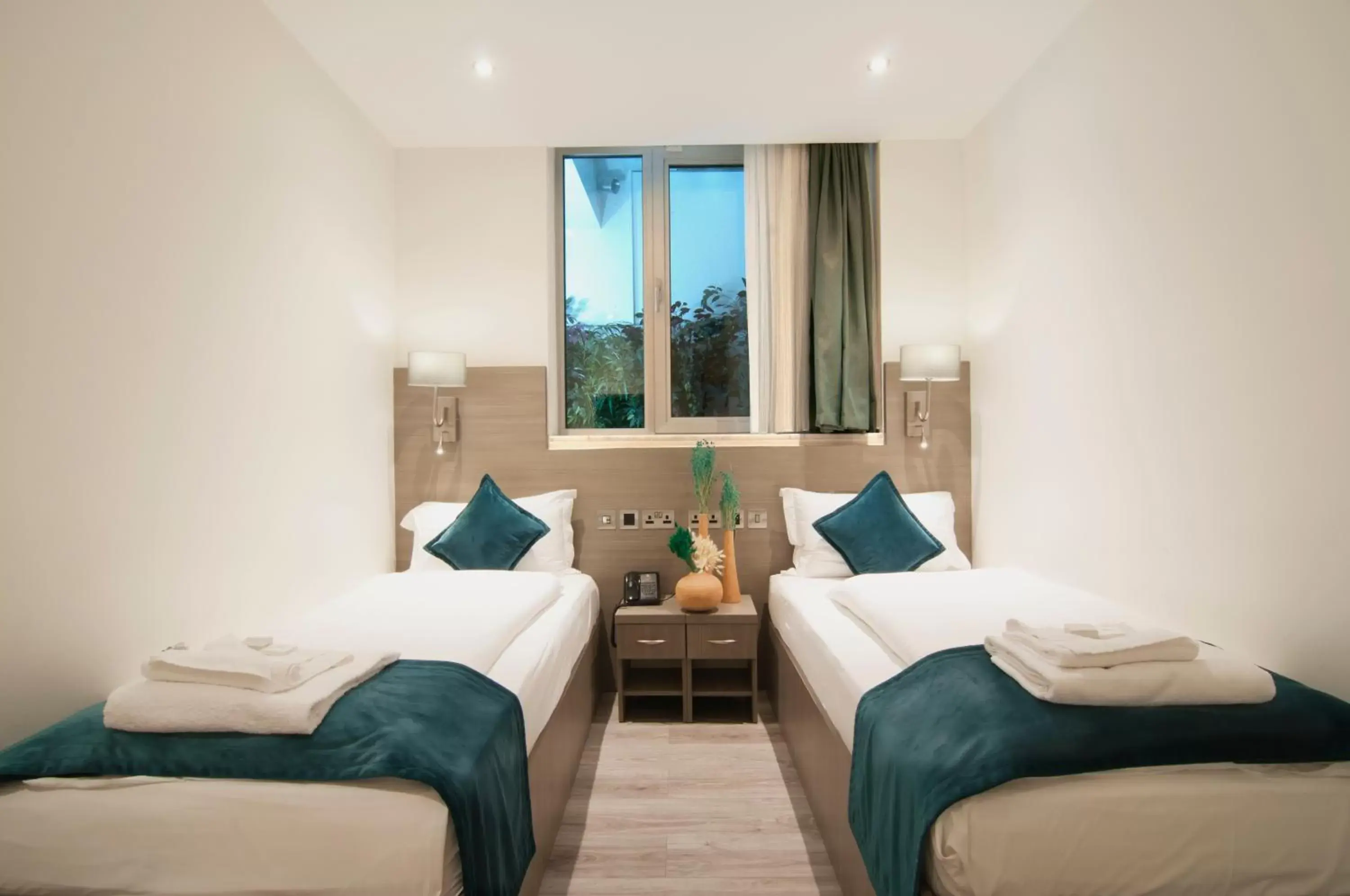 Bed in The Lion & Key Hotel Bed in The Lion & Key Hotel