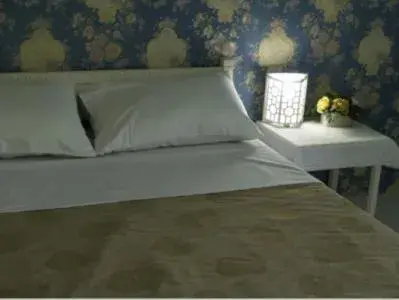 Bed in Chomdao Hotel