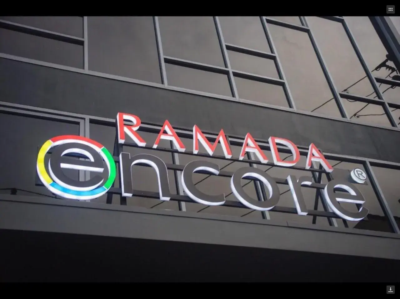Property logo or sign in Ramada Encore Makati
