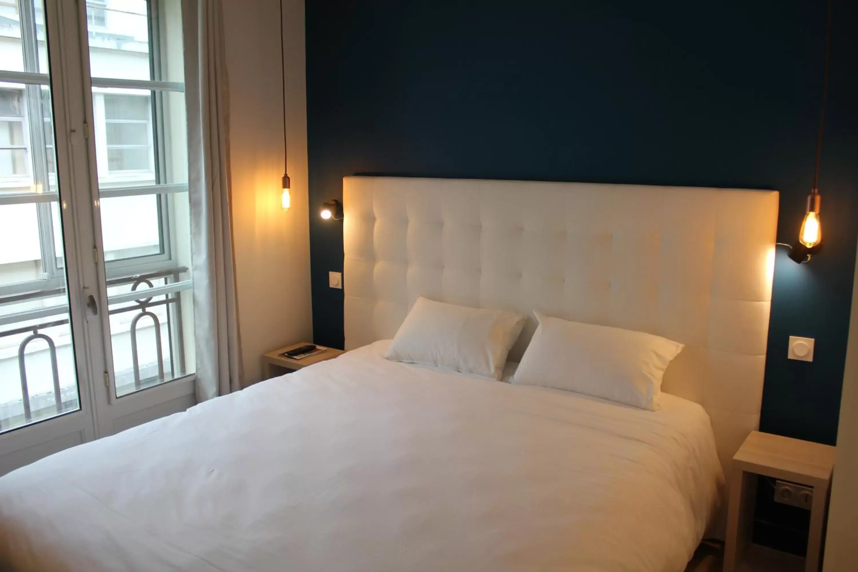 Photo of the whole room, Bed in Hôtel La Fontaine Caen Centre