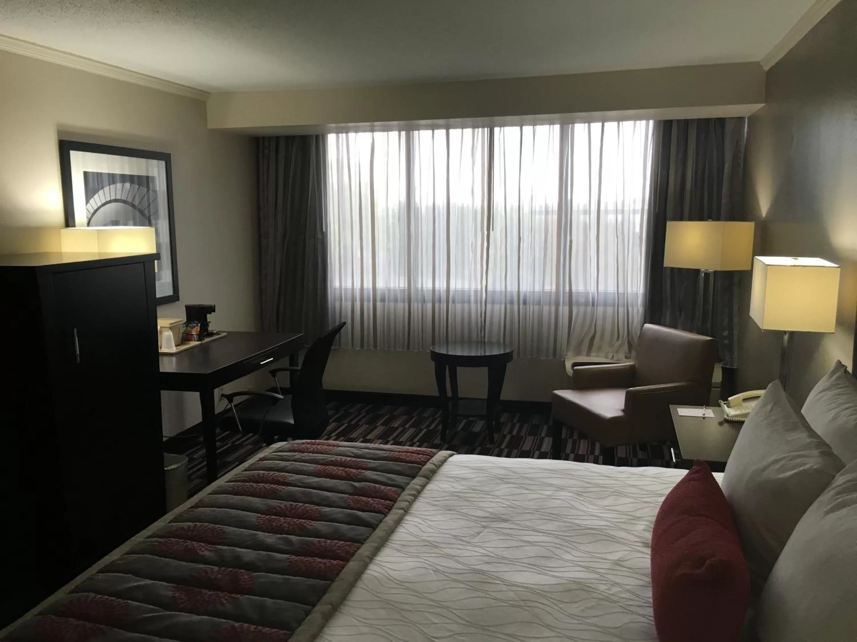 Bed in Ramada Plaza by Wyndham Charlotte South End Airport