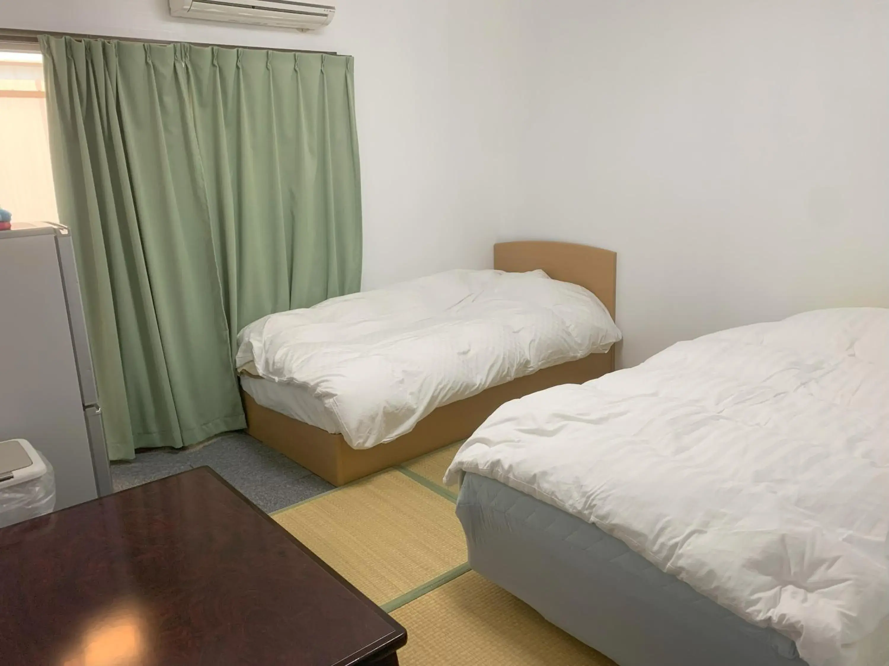 Bed in Oyama Guest House Kyoto