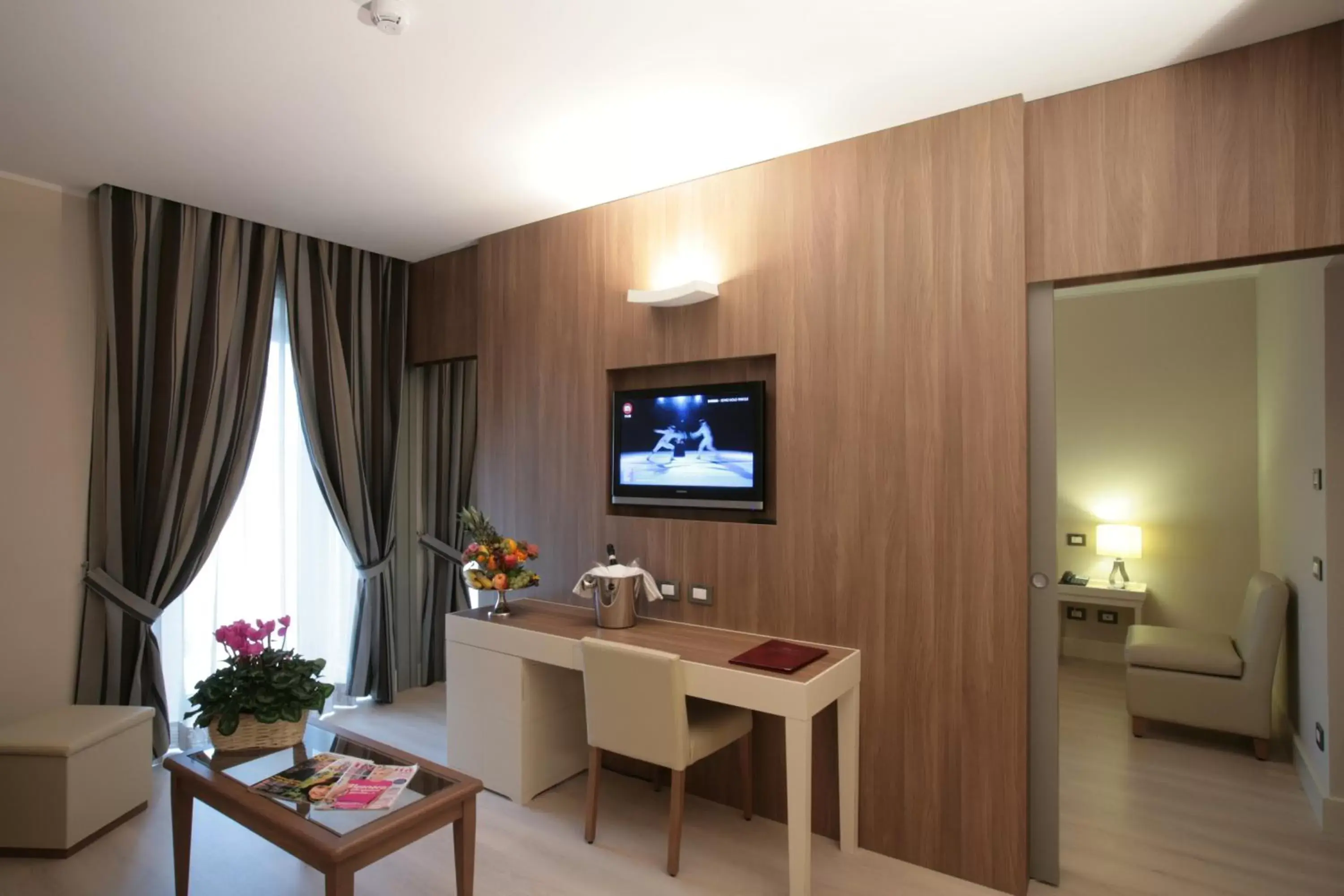 TV and multimedia, TV/Entertainment Center in Hotel Mirasole International