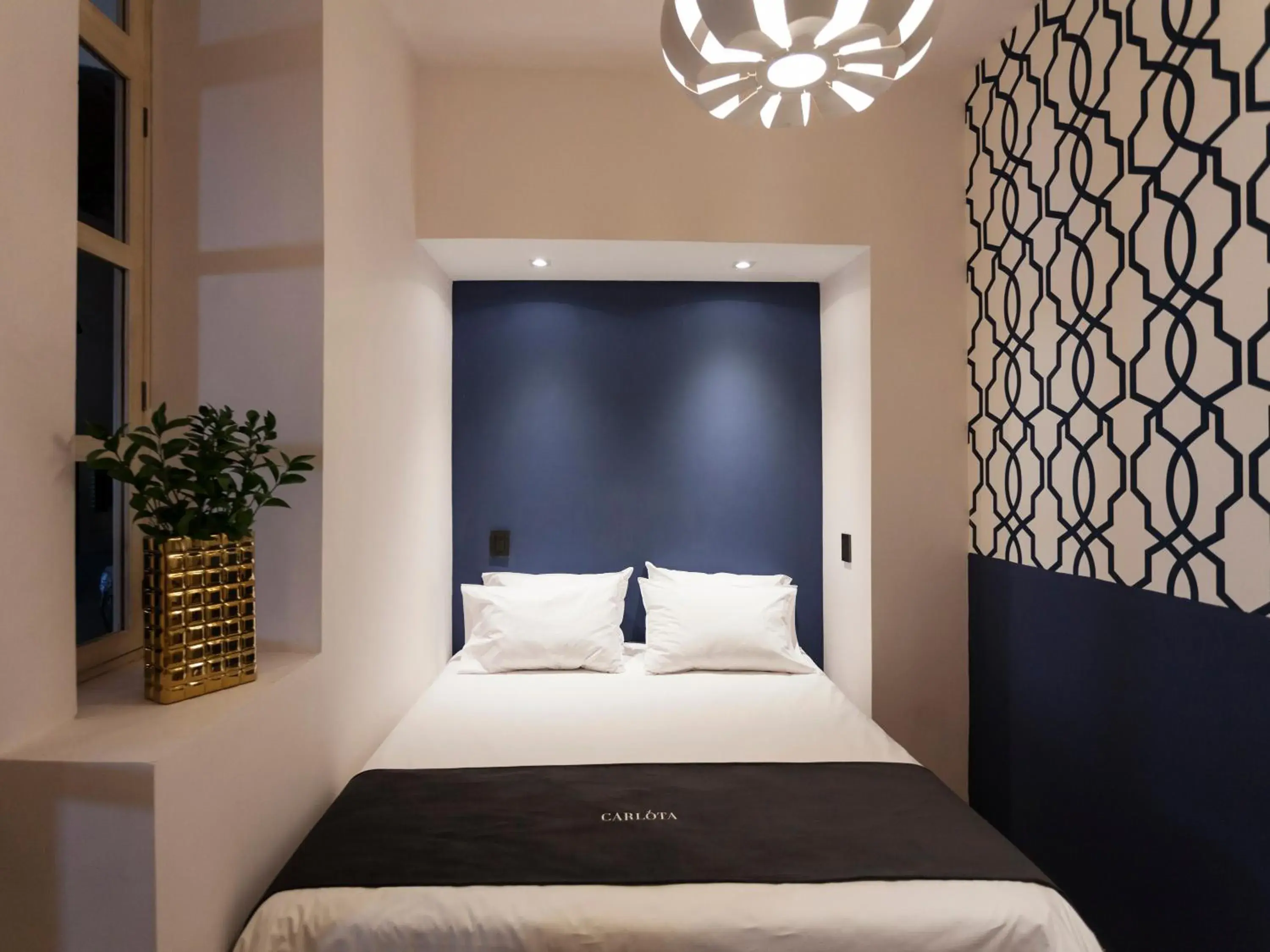 Bed in Carlota Sustainable Design Hotel