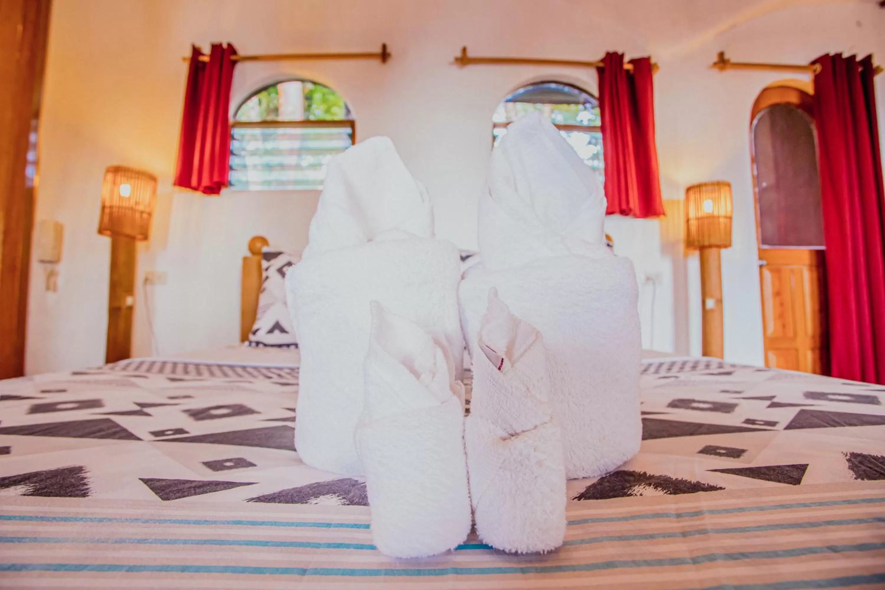 towels, Bed in Atremaru Jungle Retreat