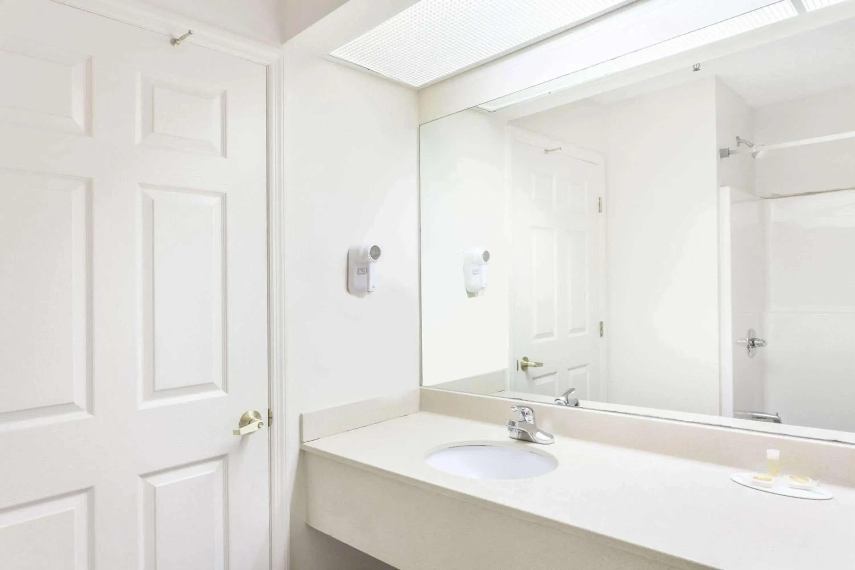Bathroom in Days Inn & Suites by Wyndham Huntsville