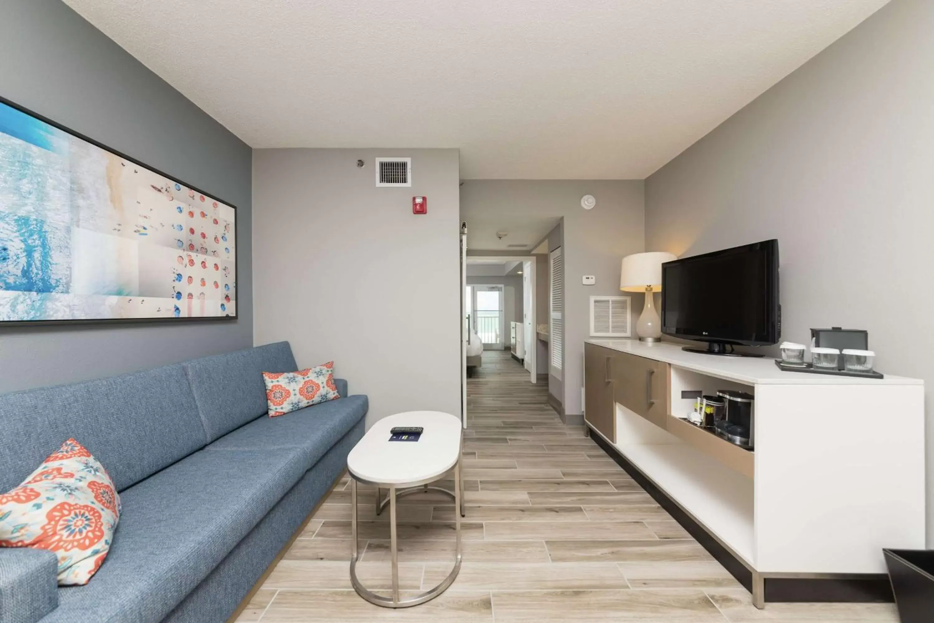 Bed, Seating Area in DoubleTree Suites by Hilton Melbourne Beach Oceanfront