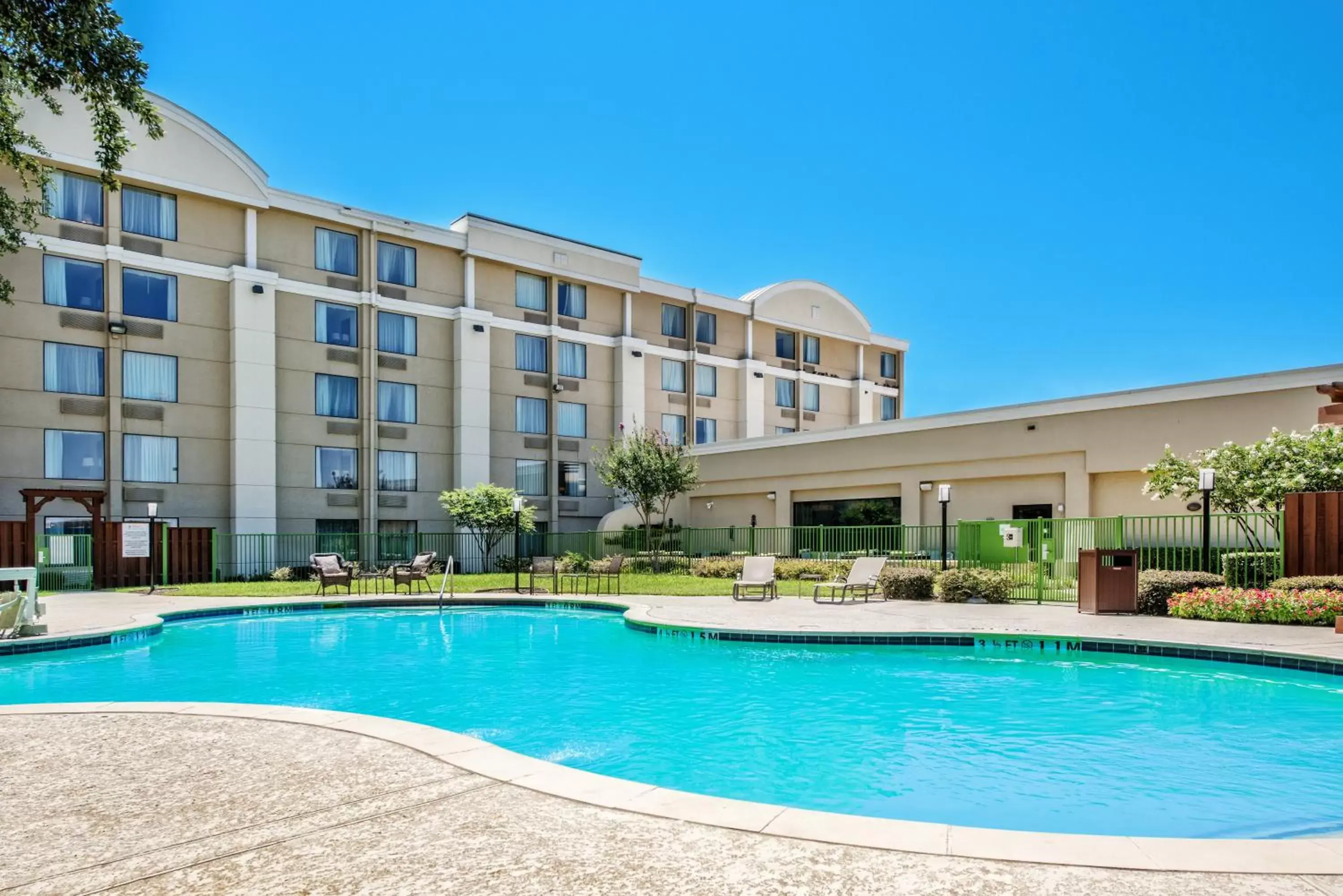 Swimming pool, Property Building in Holiday Inn Hotel Dallas DFW Airport West, an IHG Hotel
