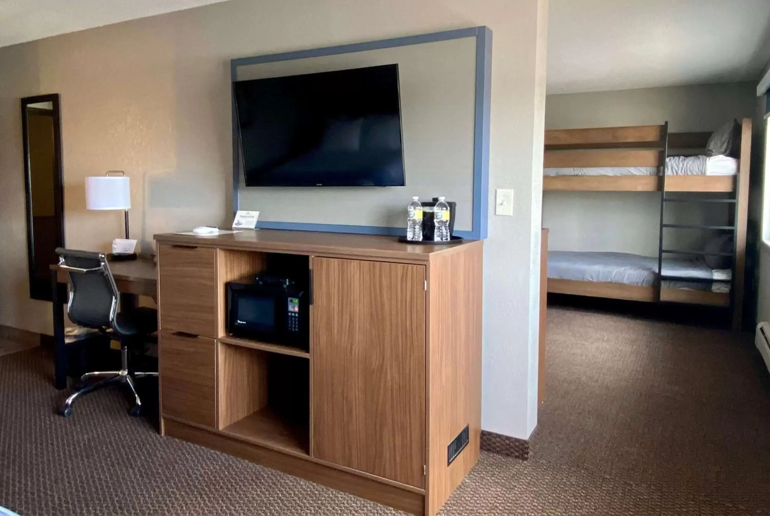 Photo of the whole room, TV/Entertainment Center in AmericInn by Wyndham New Richmond