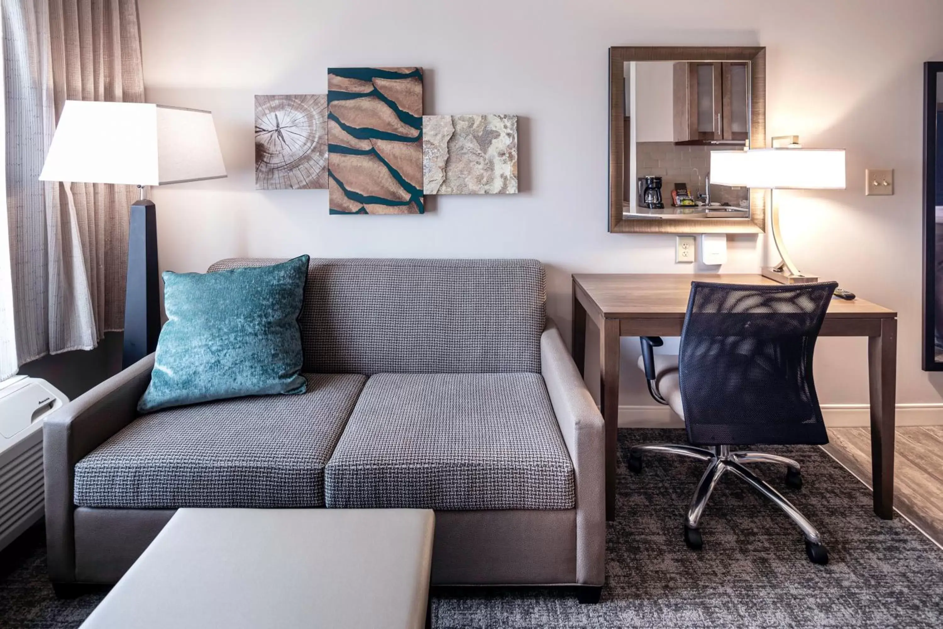 Photo of the whole room, Seating Area in Staybridge Suites Montgomery - Downtown, an IHG Hotel