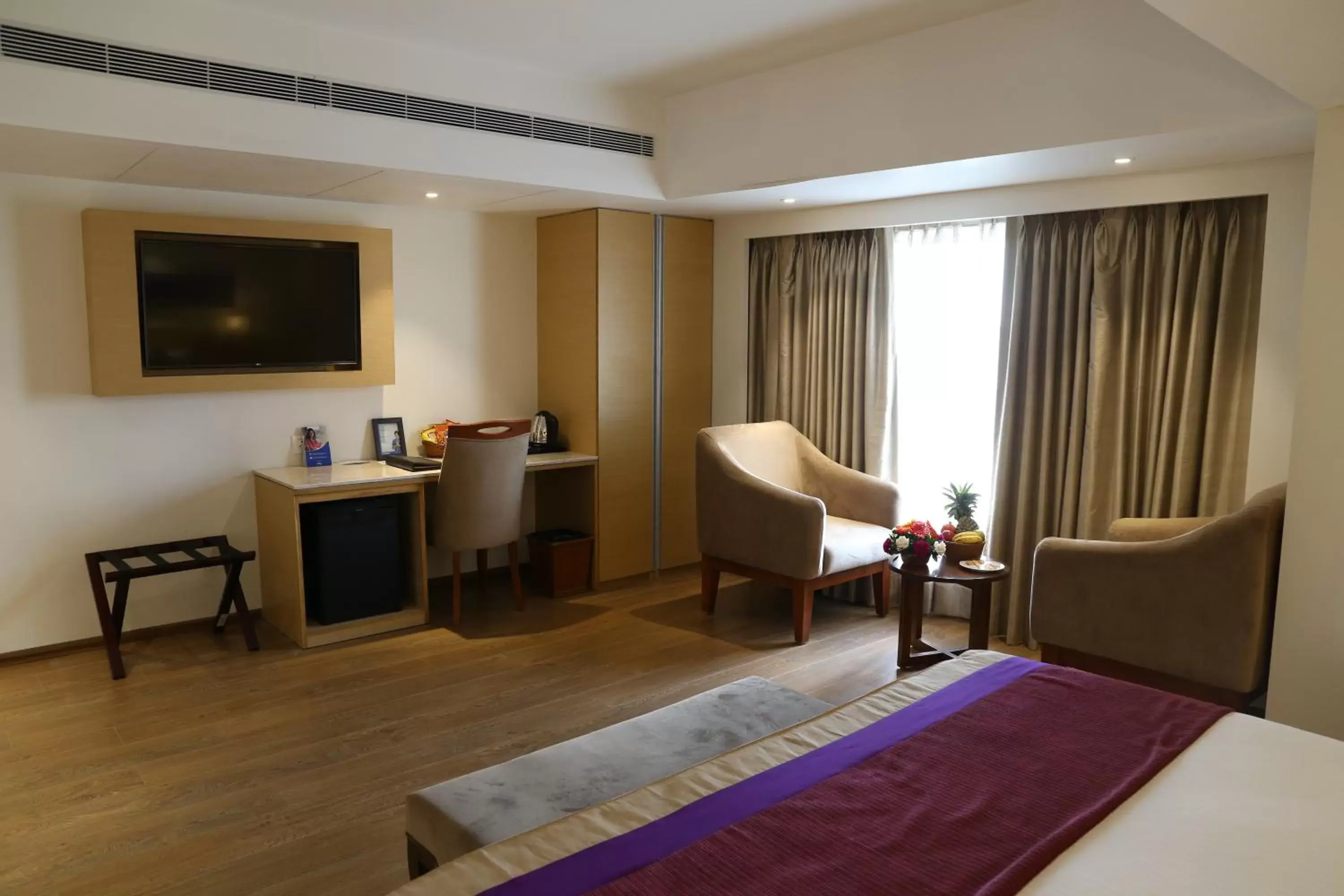 Bedroom, TV/Entertainment Center in Sarovar Portico Rivera Ahmedabad