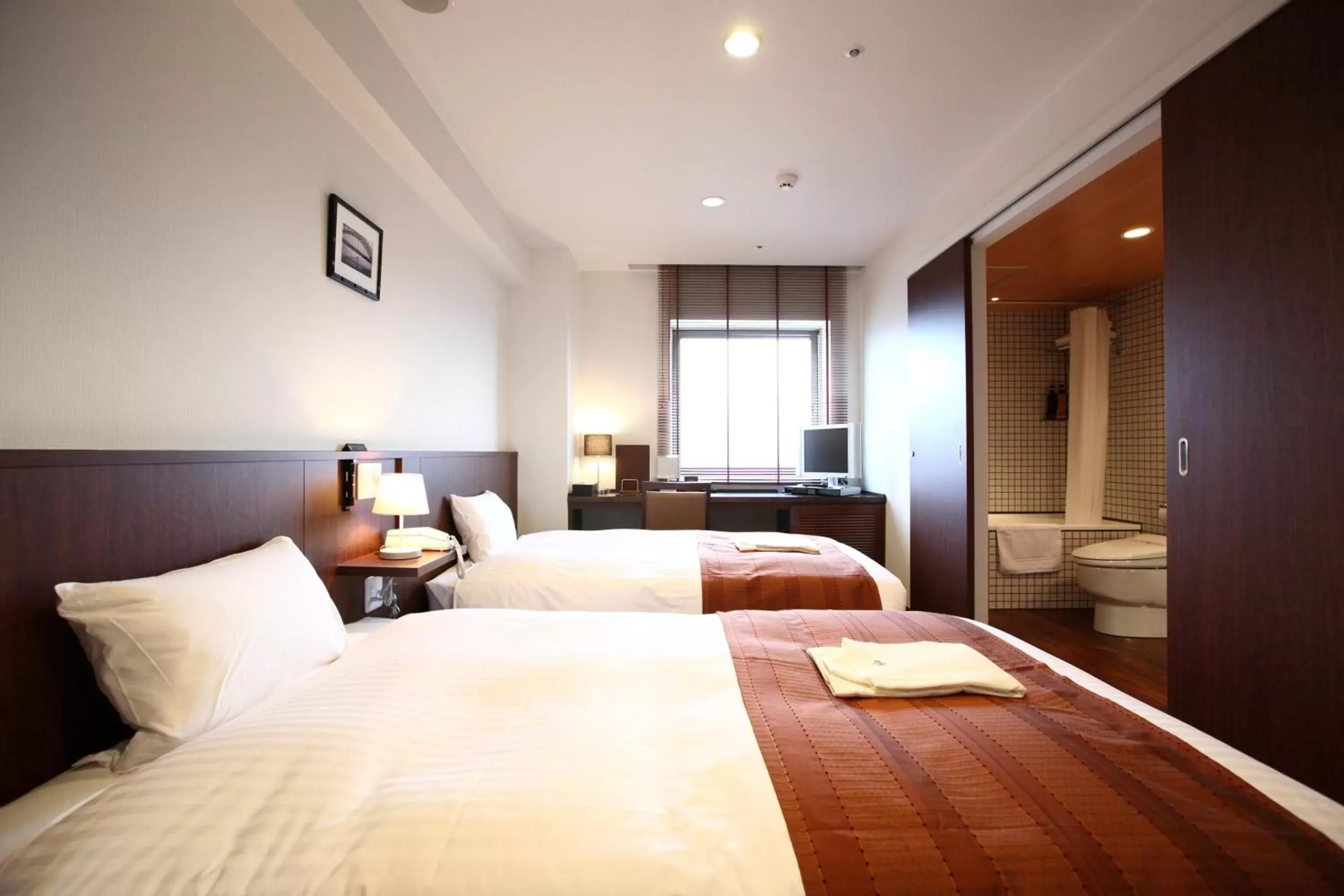 Bed in Sutton Hotel Hakata City