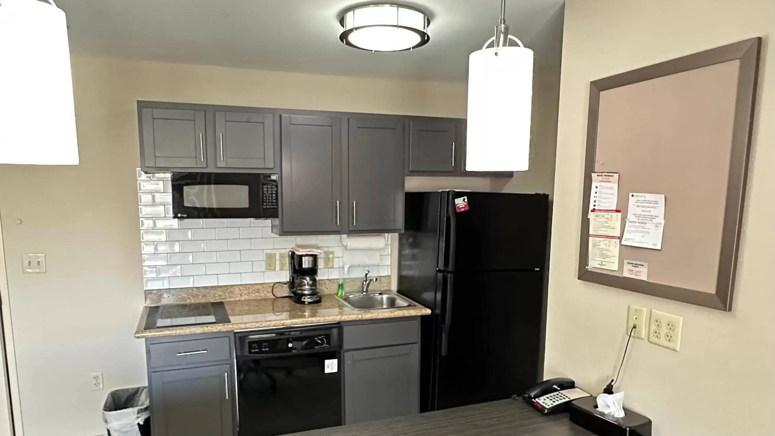 Kitchen or kitchenette, Kitchen/Kitchenette in Candlewood Suites South Bend Airport, an IHG Hotel