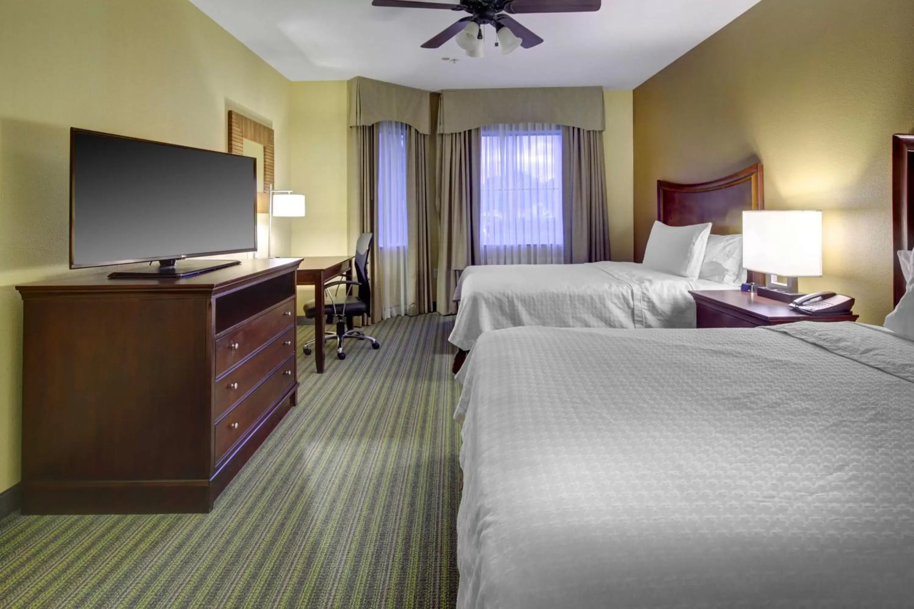 Bedroom, TV/Entertainment Center in Homewood Suites by Hilton West Palm Beach