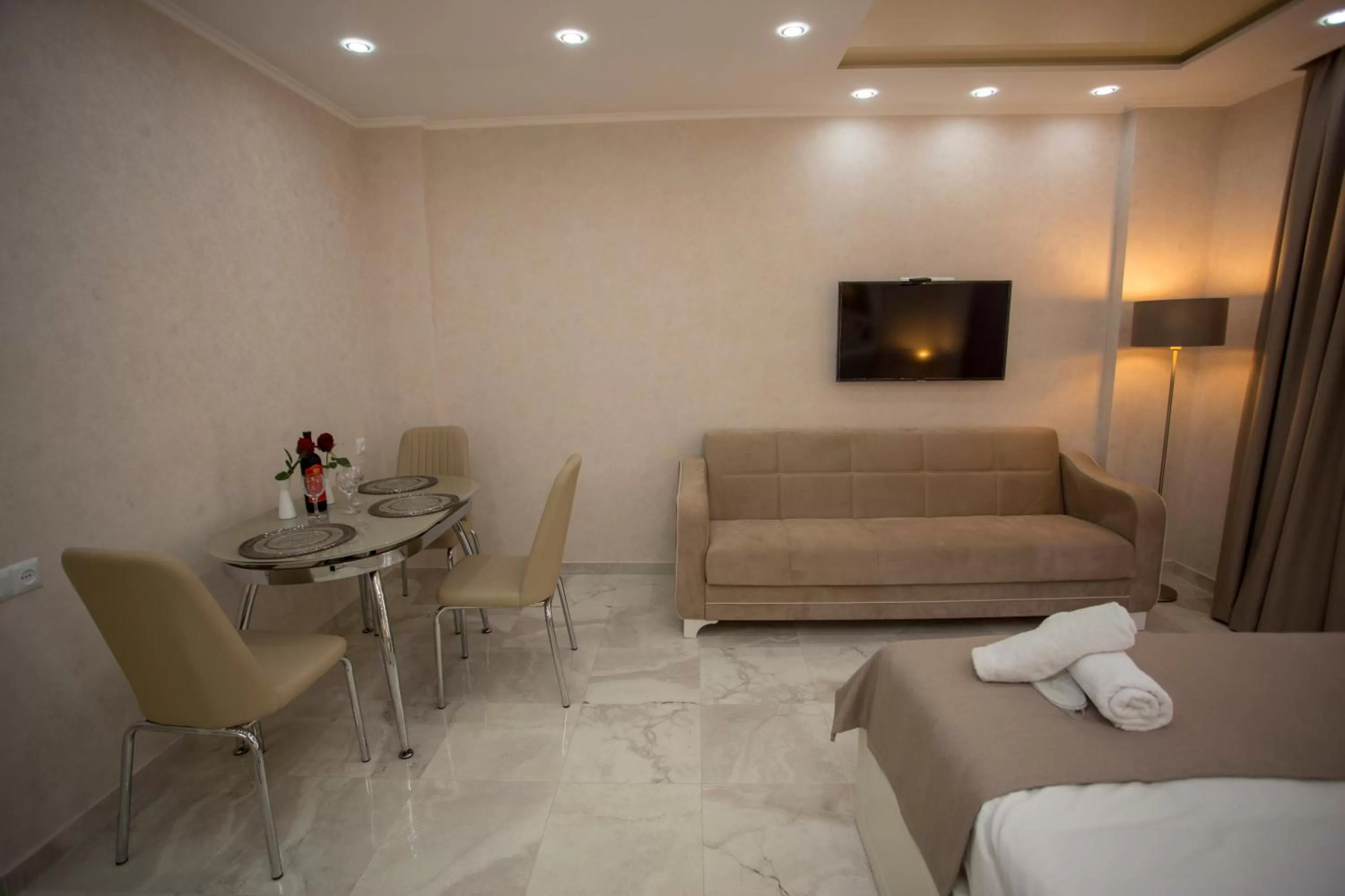 Seating area, Bed in Blue Star Batumi