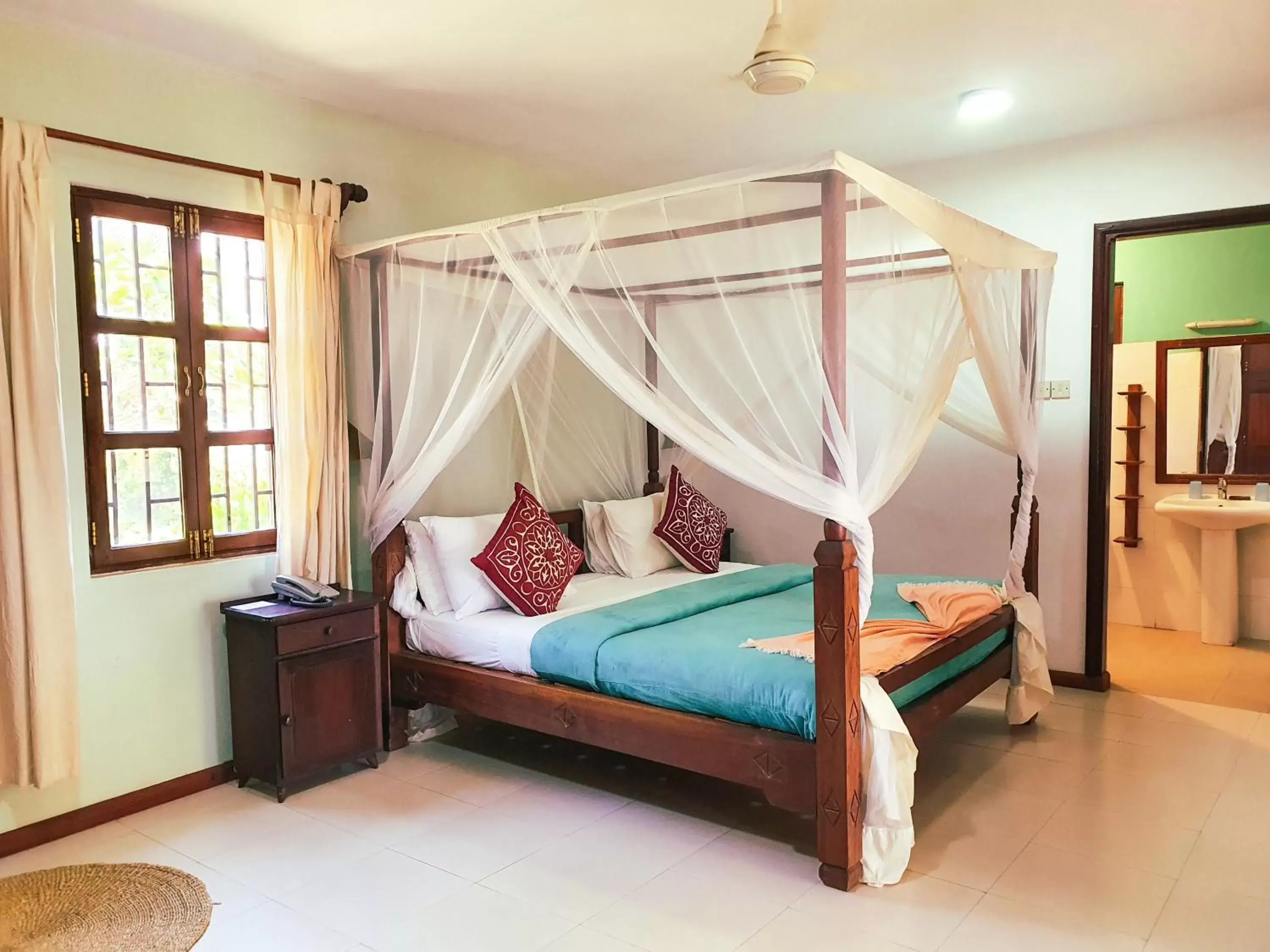 Bed in Flame Tree Cottages