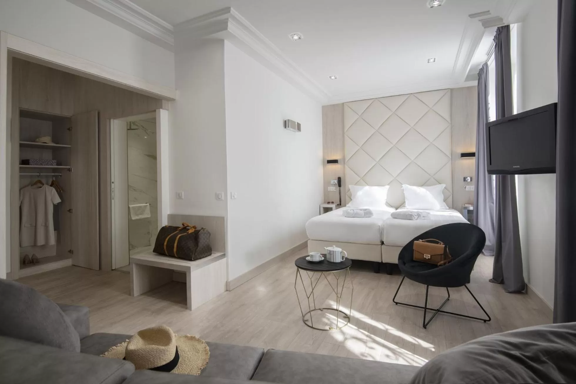 Photo of the whole room, Bed in GOLDEN TULIP CANNES HOTEL de PARIS