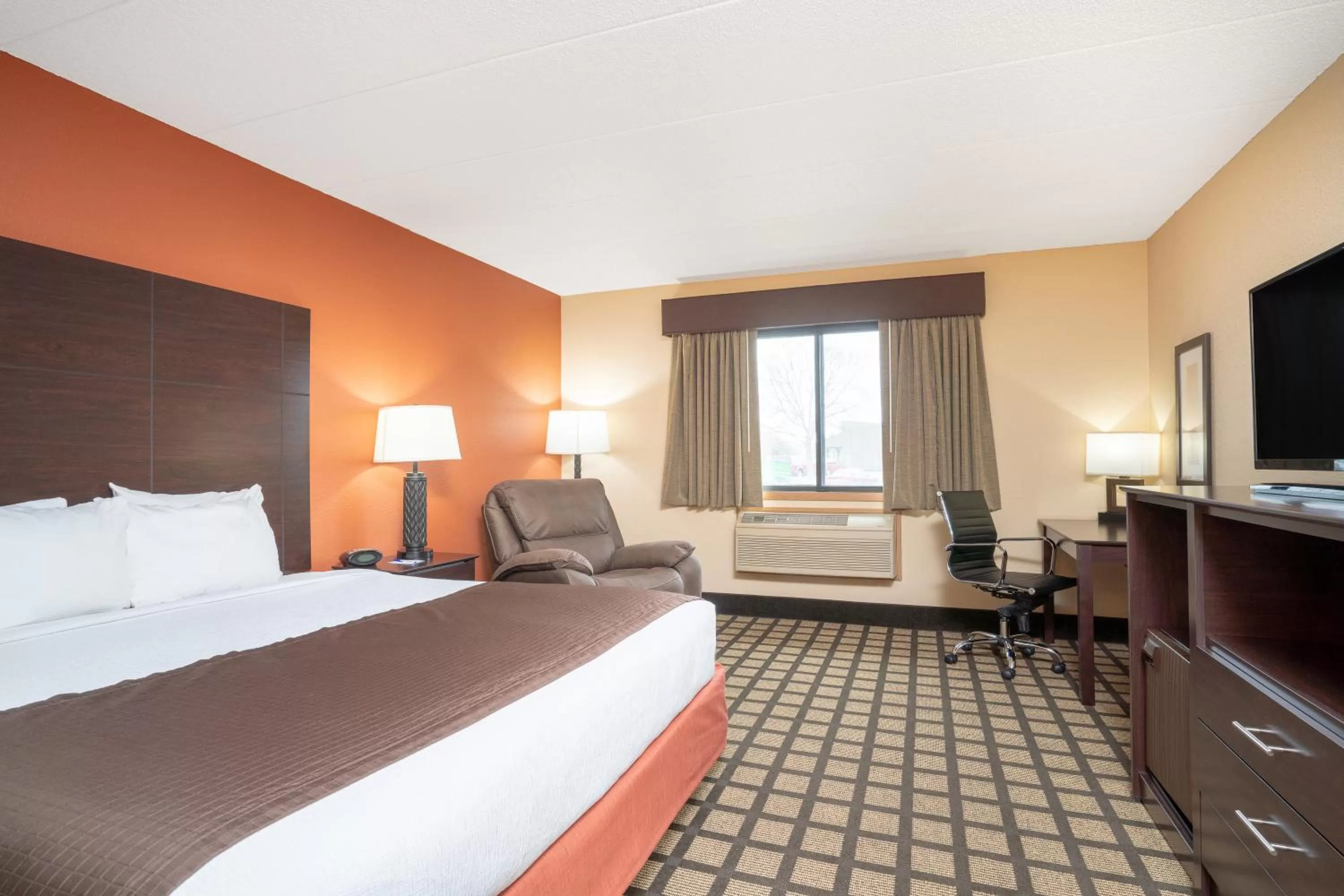 Bed in Baymont by Wyndham Lakeville