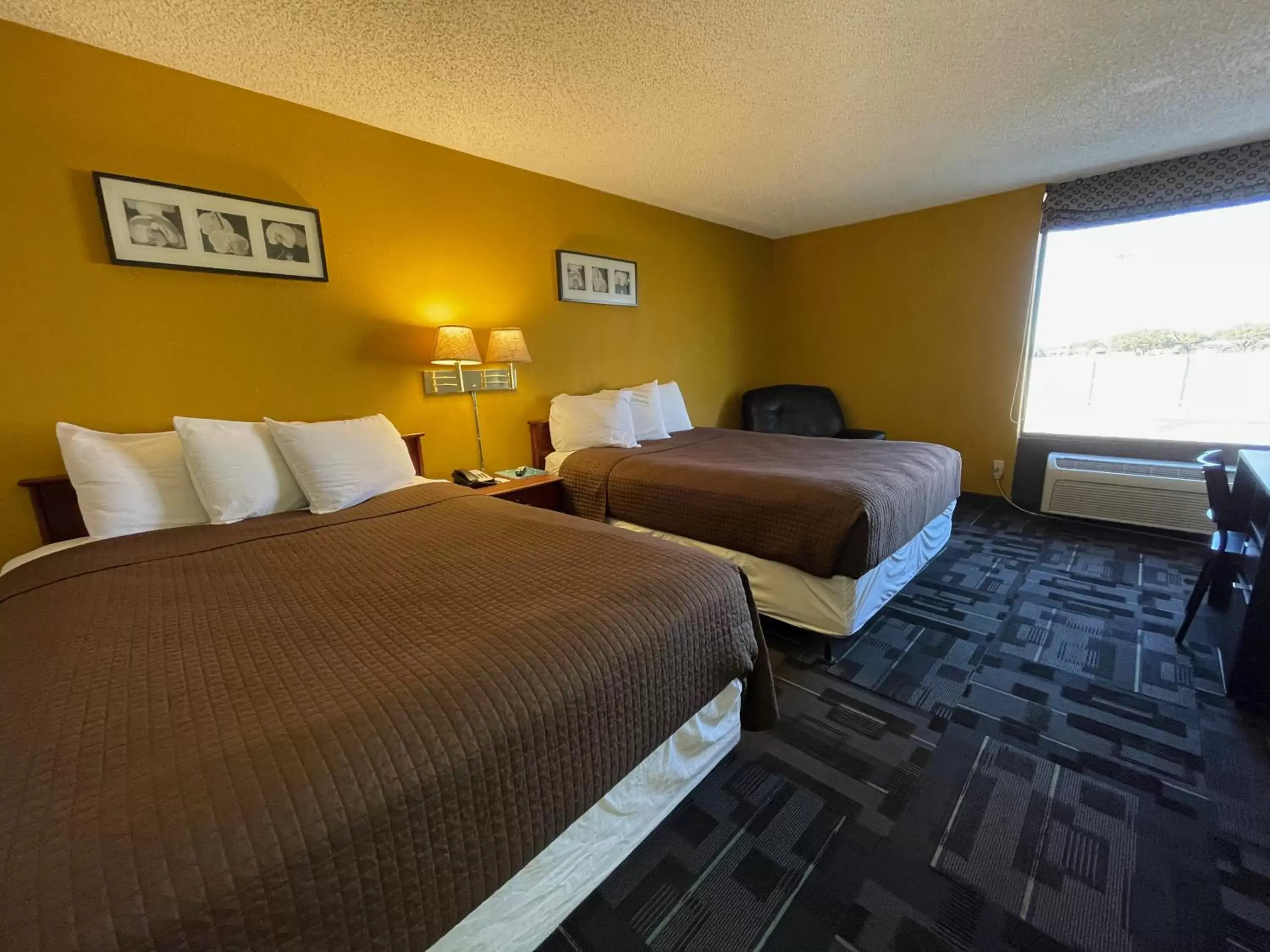 Bed in The Inn and Suites at 34 Fifty