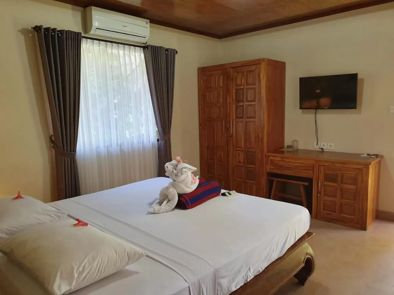 Bed in Kusnadi Hotel