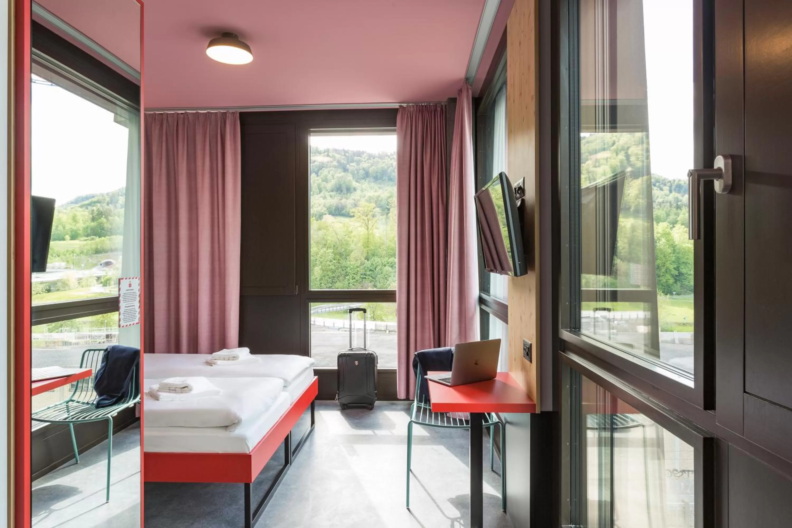 Bedroom, View in MEININGER Hotel Zürich Greencity