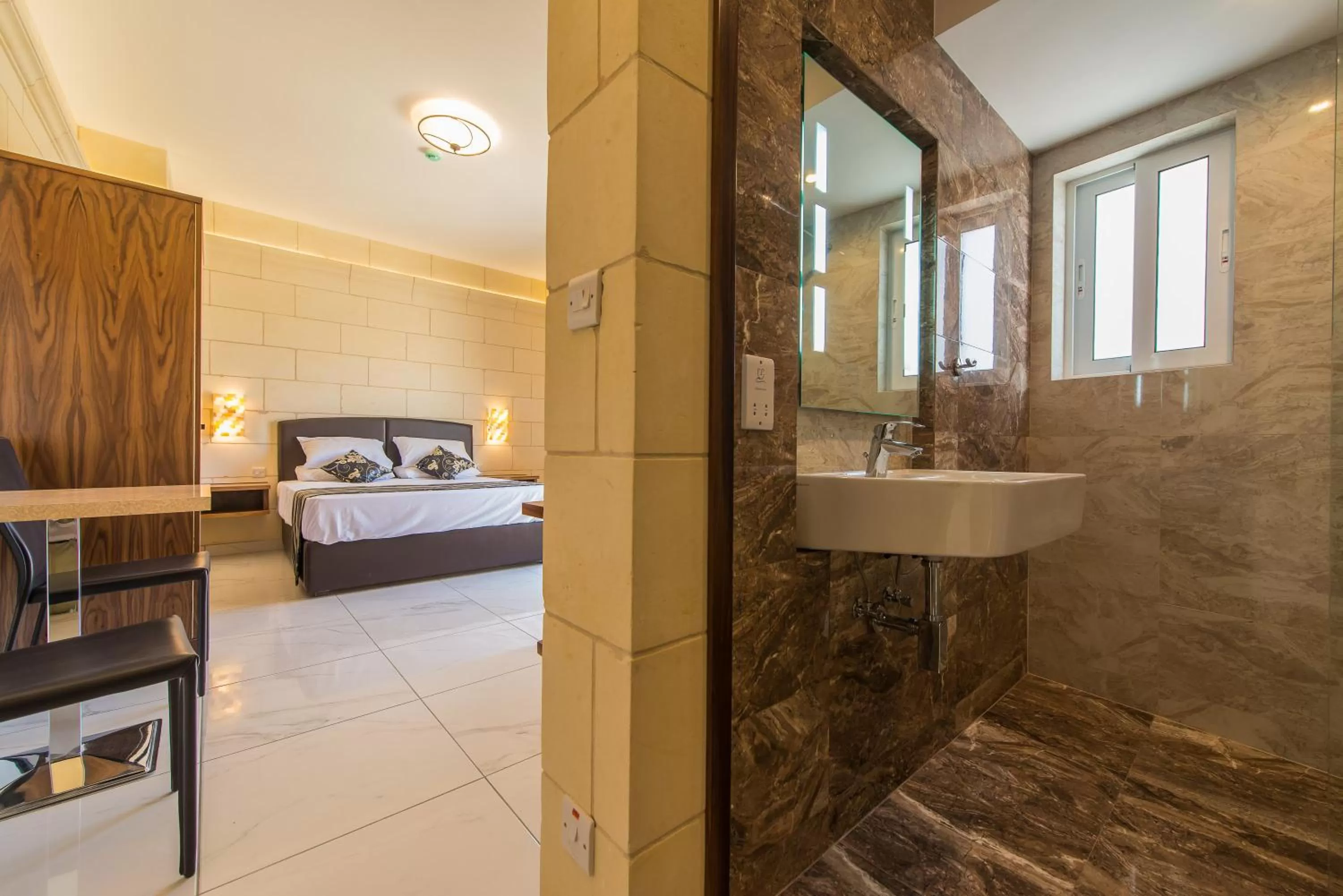 Bed in Il-Logga Boutique Hotel