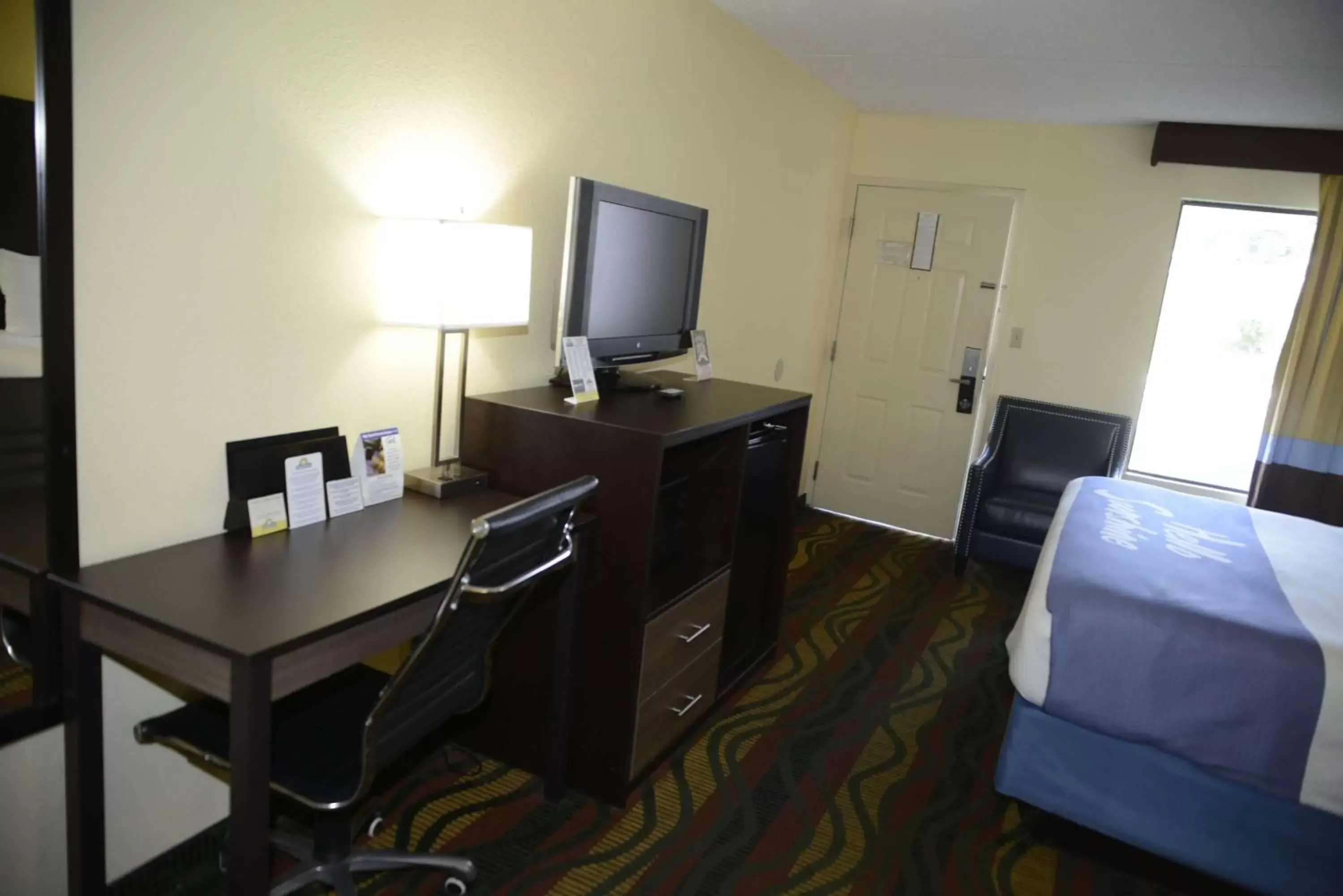 Photo of the whole room, TV/Entertainment Center in Days Inn by Wyndham Kodak/Sevierville Intrstate SmokeyMntns