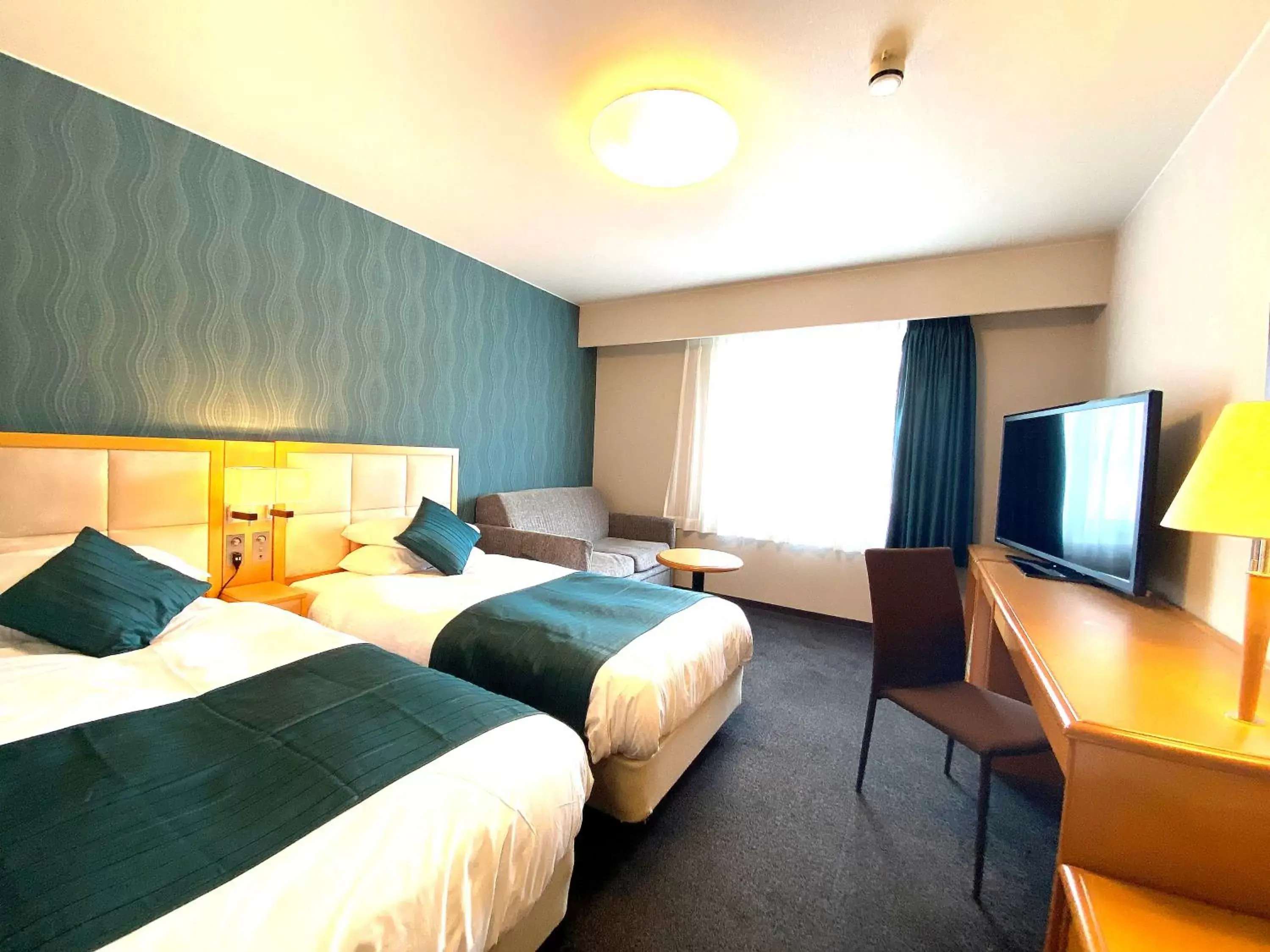 Communal lounge/ TV room, Bed in Hotel Sunroute Hikone