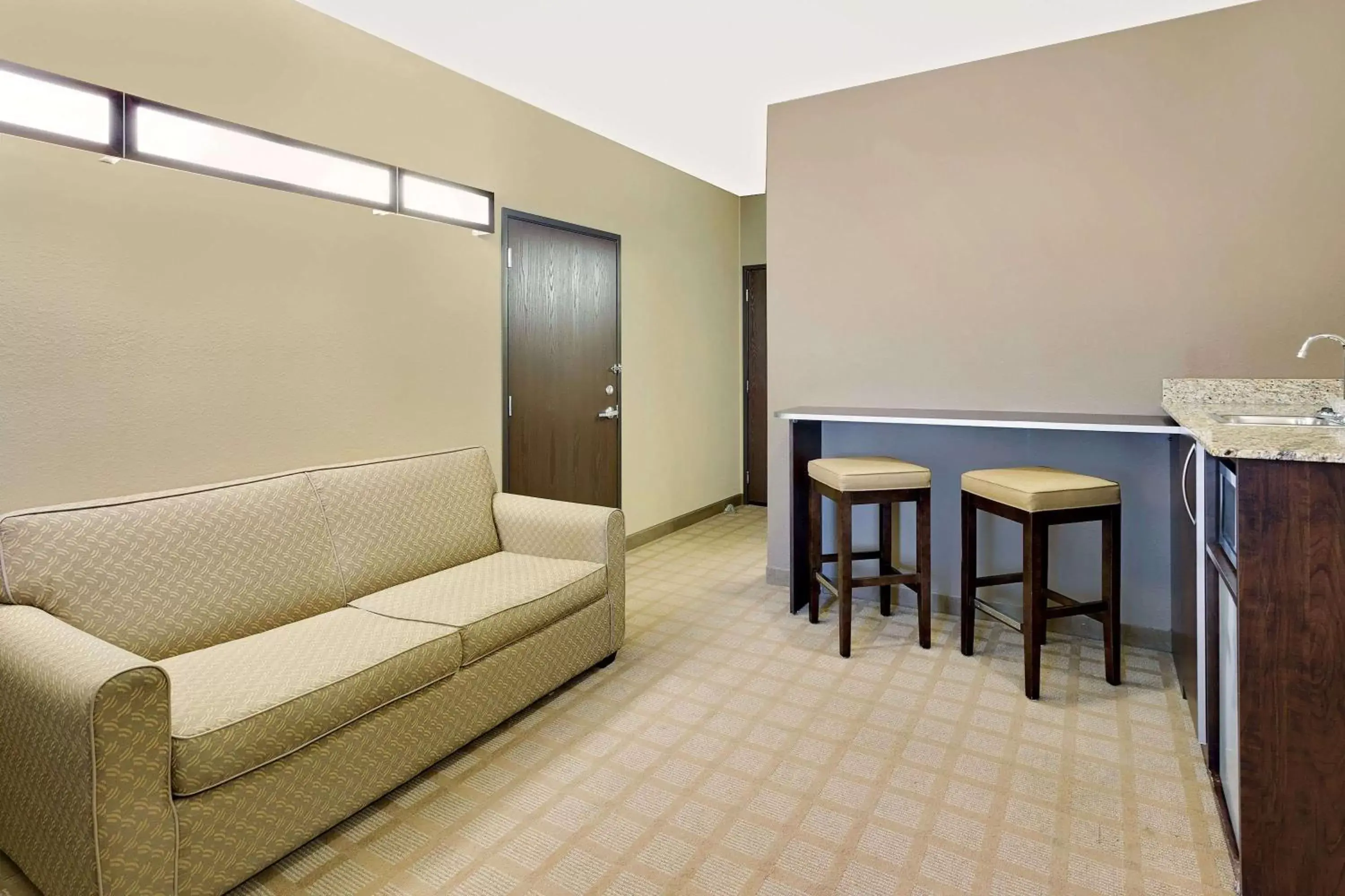 Photo of the whole room, Seating Area in Microtel Inn & Suites by Wyndham Prairie du Chien