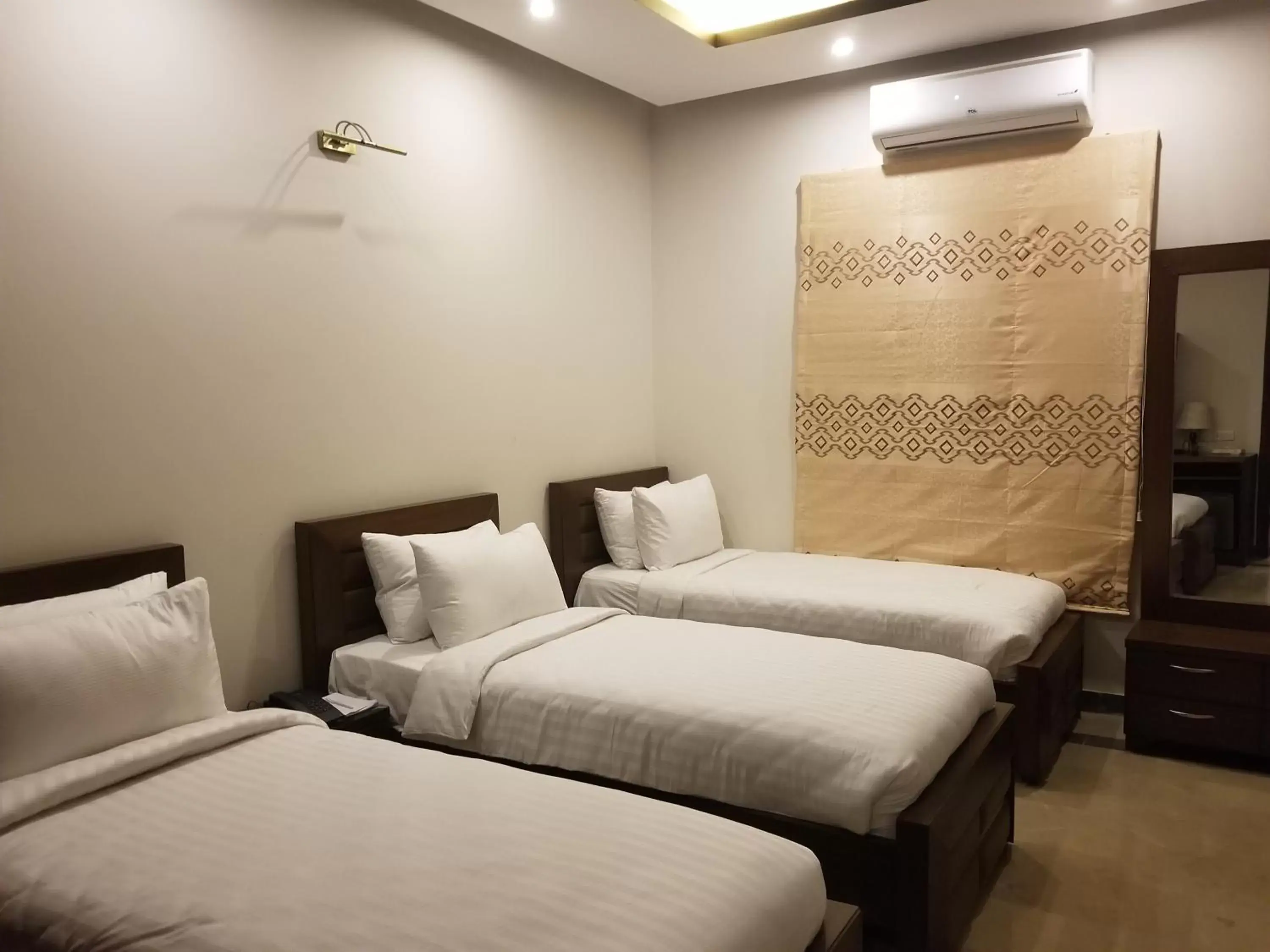 Bed in Zifan Hotel & Suites