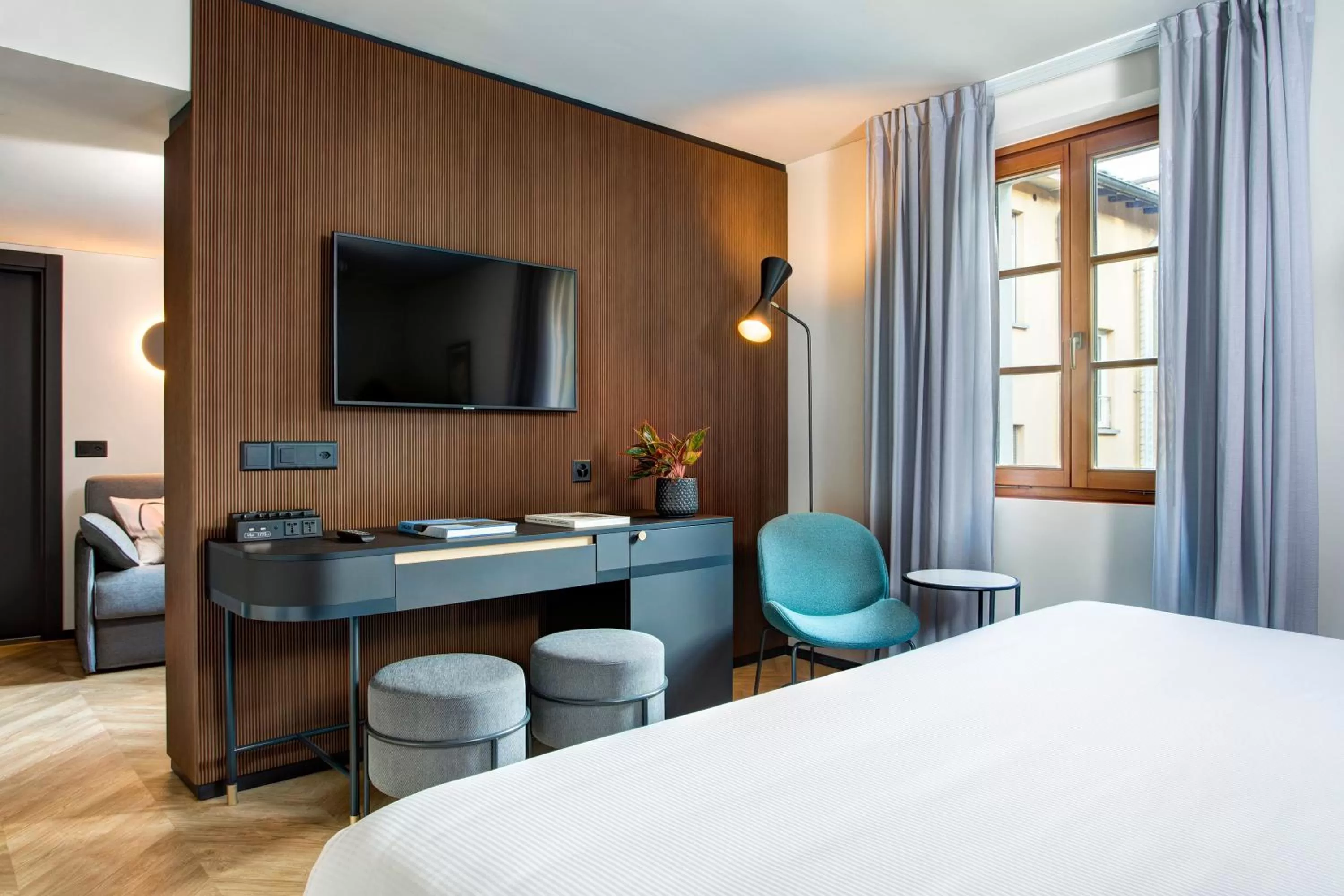 Communal lounge/ TV room, Bed in LUGANODANTE Boutique & Lifestyle Hotel