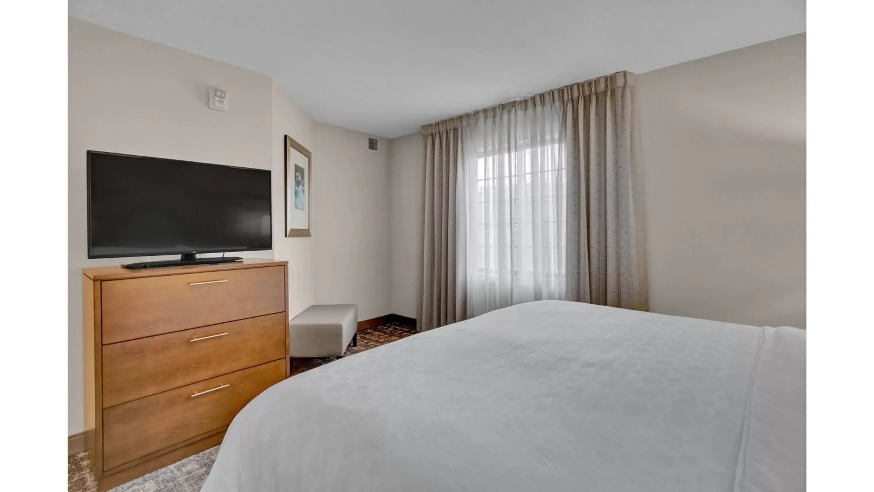 Photo of the whole room, TV/Entertainment Center in Staybridge Suites Salt Lake-West Valley City, an IHG Hotel