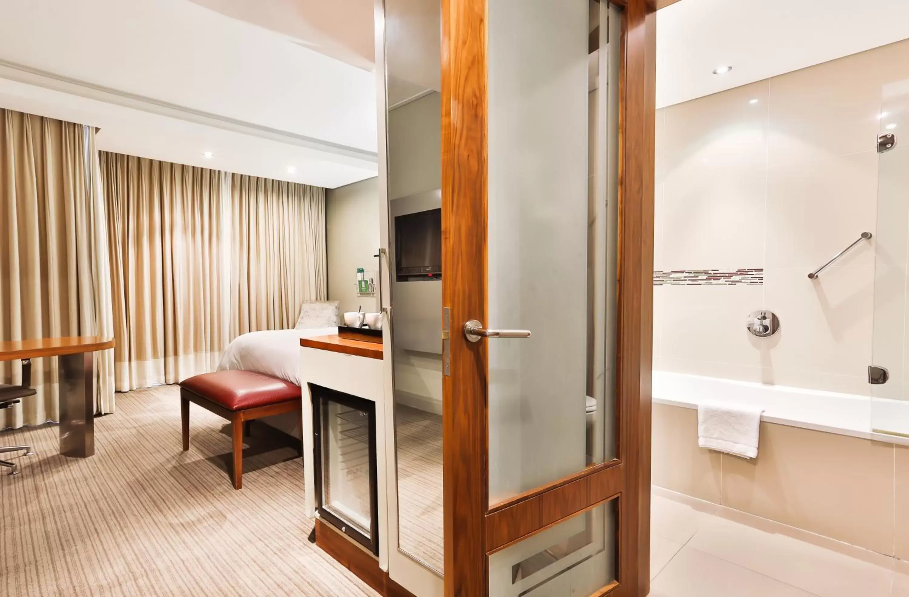 Property building, Bathroom in Holiday Inn Johannesburg-Rosebank, an IHG Hotel