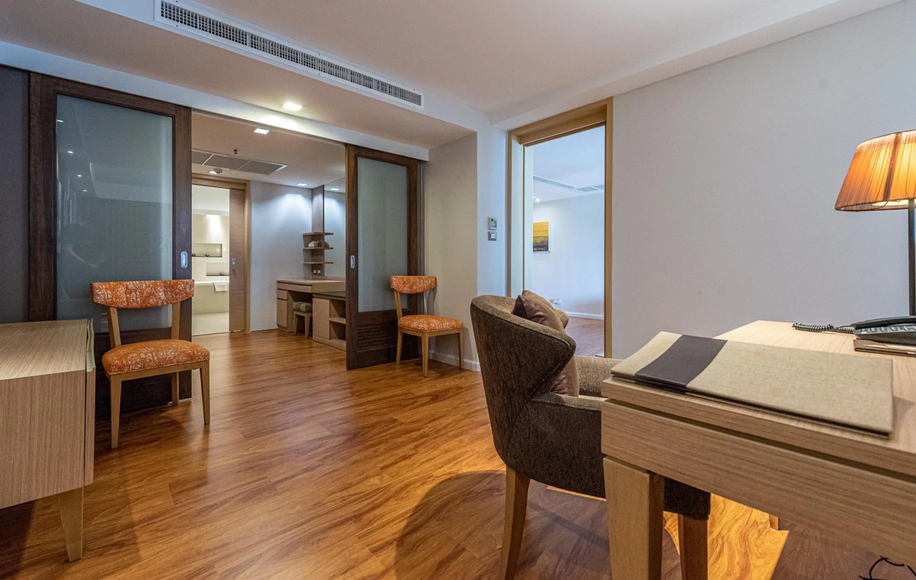 Living room in Summit Windmill Golf Suite Hotel at Suvarnabhumi