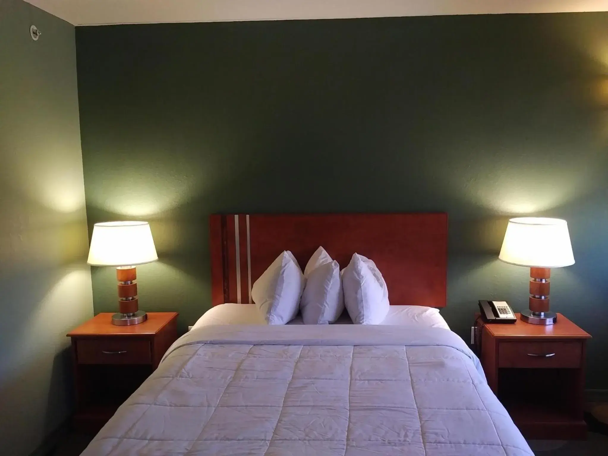 Bed in Marble Waters Hotel & Suites, Trademark by Wyndham