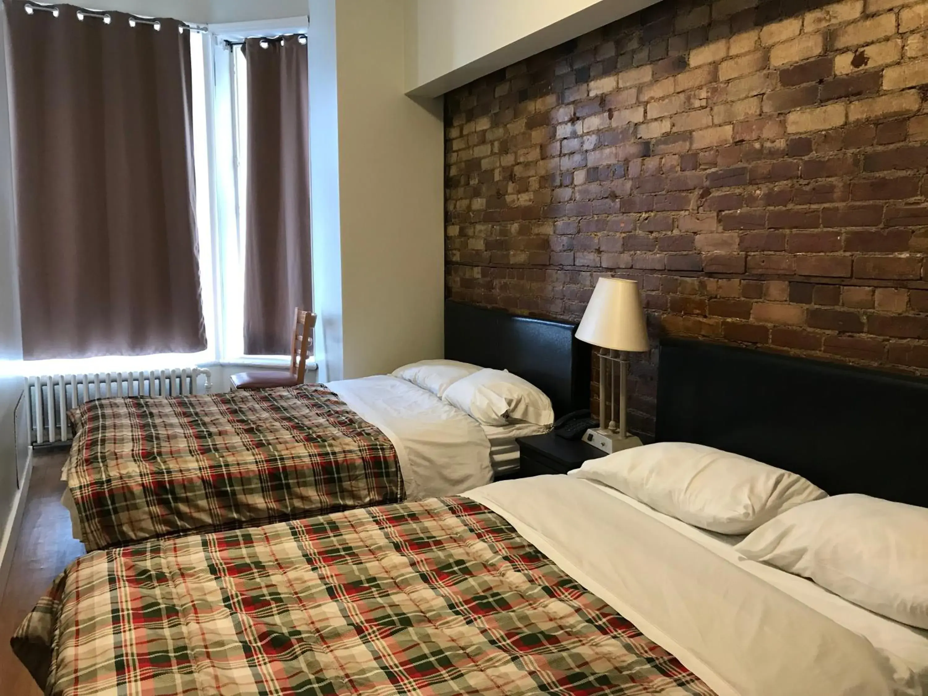 Bed in Hotel La Residence du Voyageur