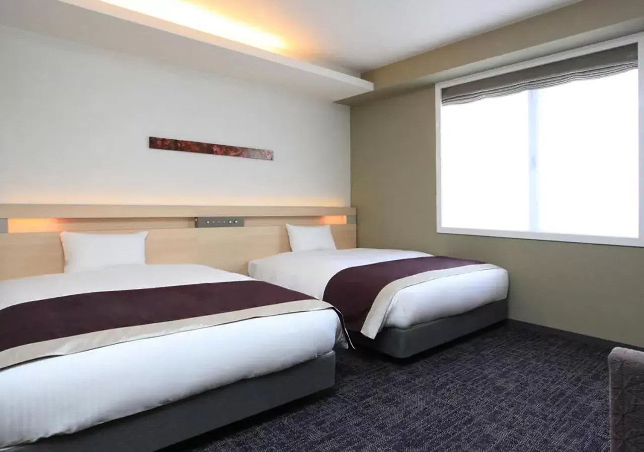 Bed in Urban Hotel Kyoto Shijo Premium