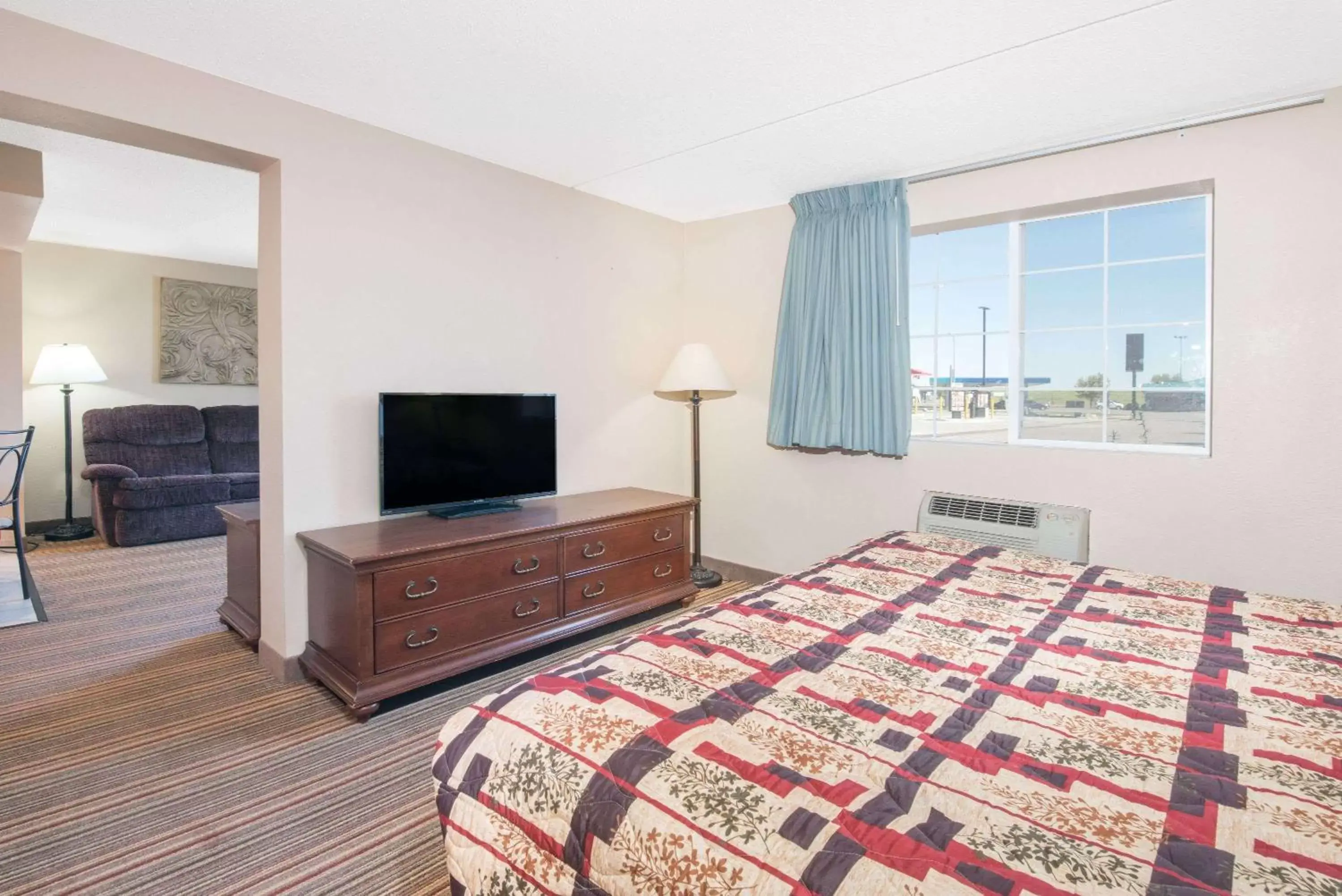 Photo of the whole room, TV/Entertainment Center in Knights Inn and Suites - Grand Forks