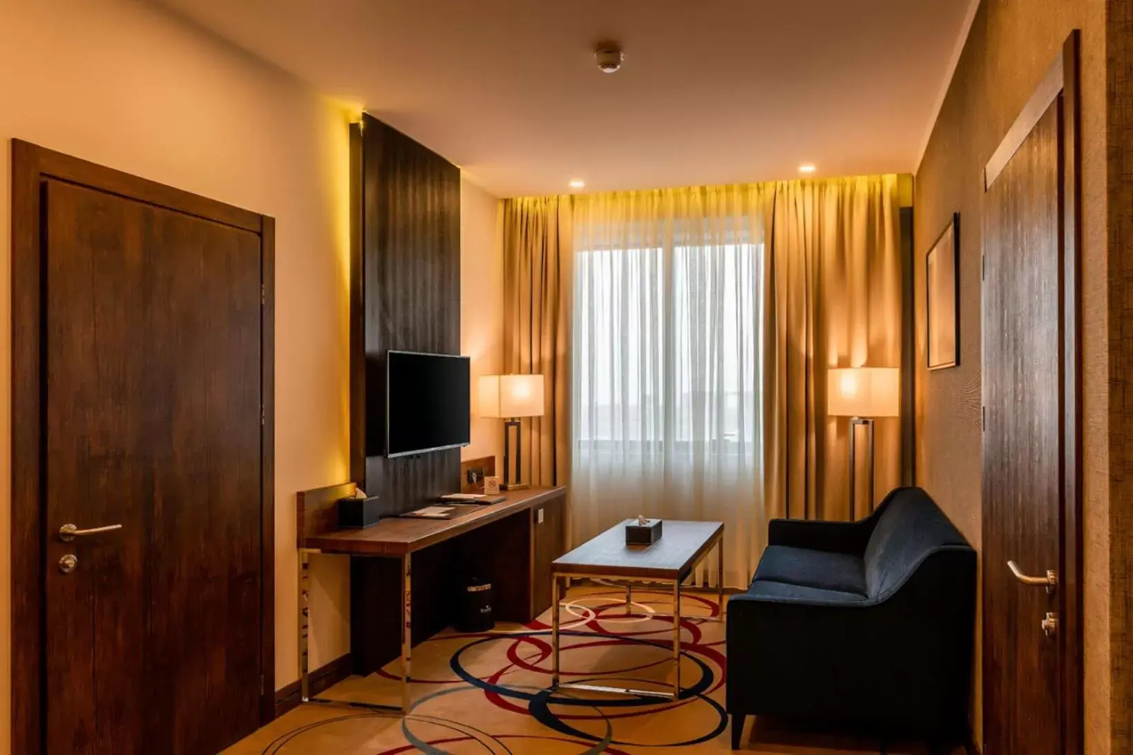 Living room, TV/Entertainment Center in Ramada Hotel & Suites by Wyndham Yerevan