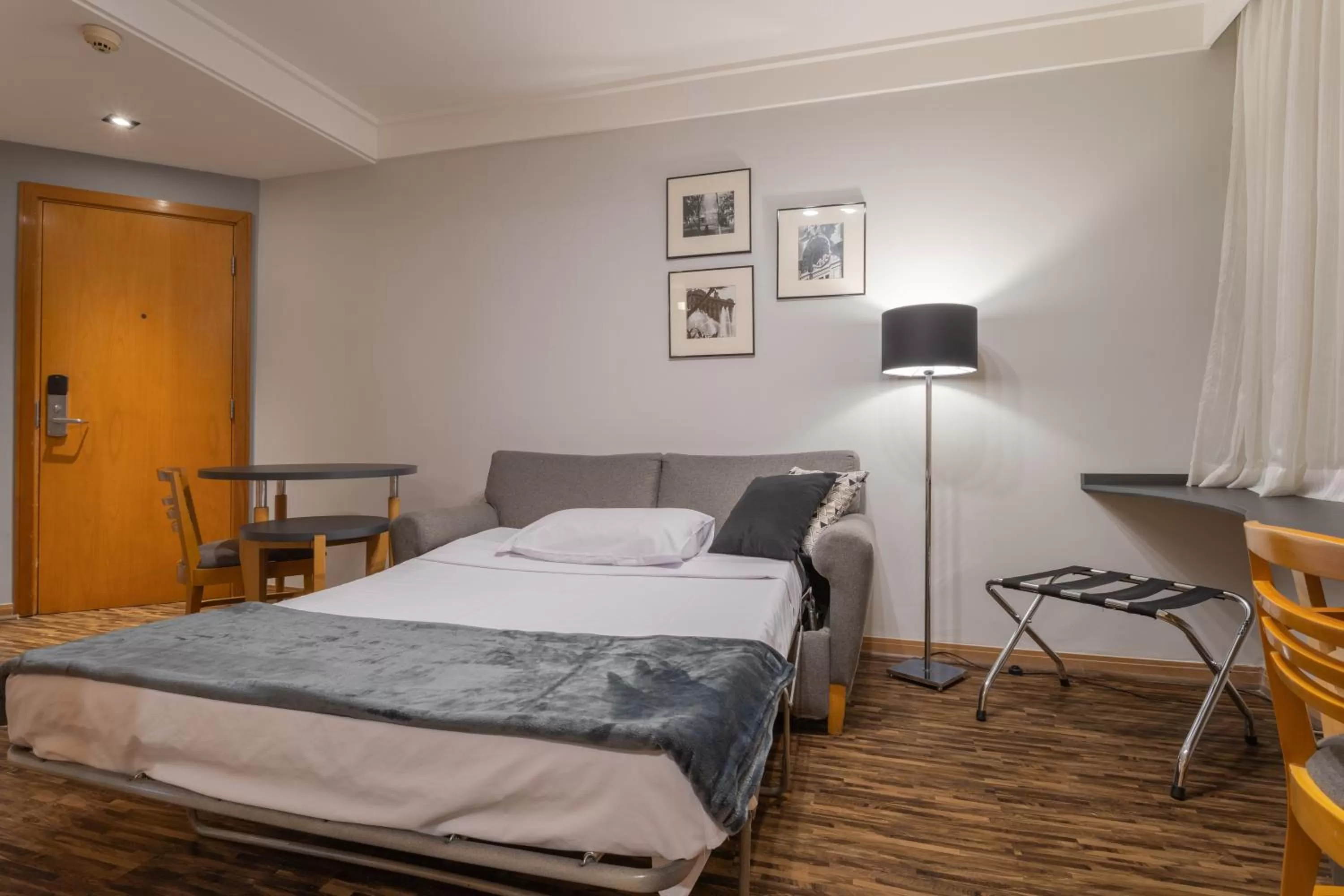 Living room, Bed in Green Place Ibirapuera