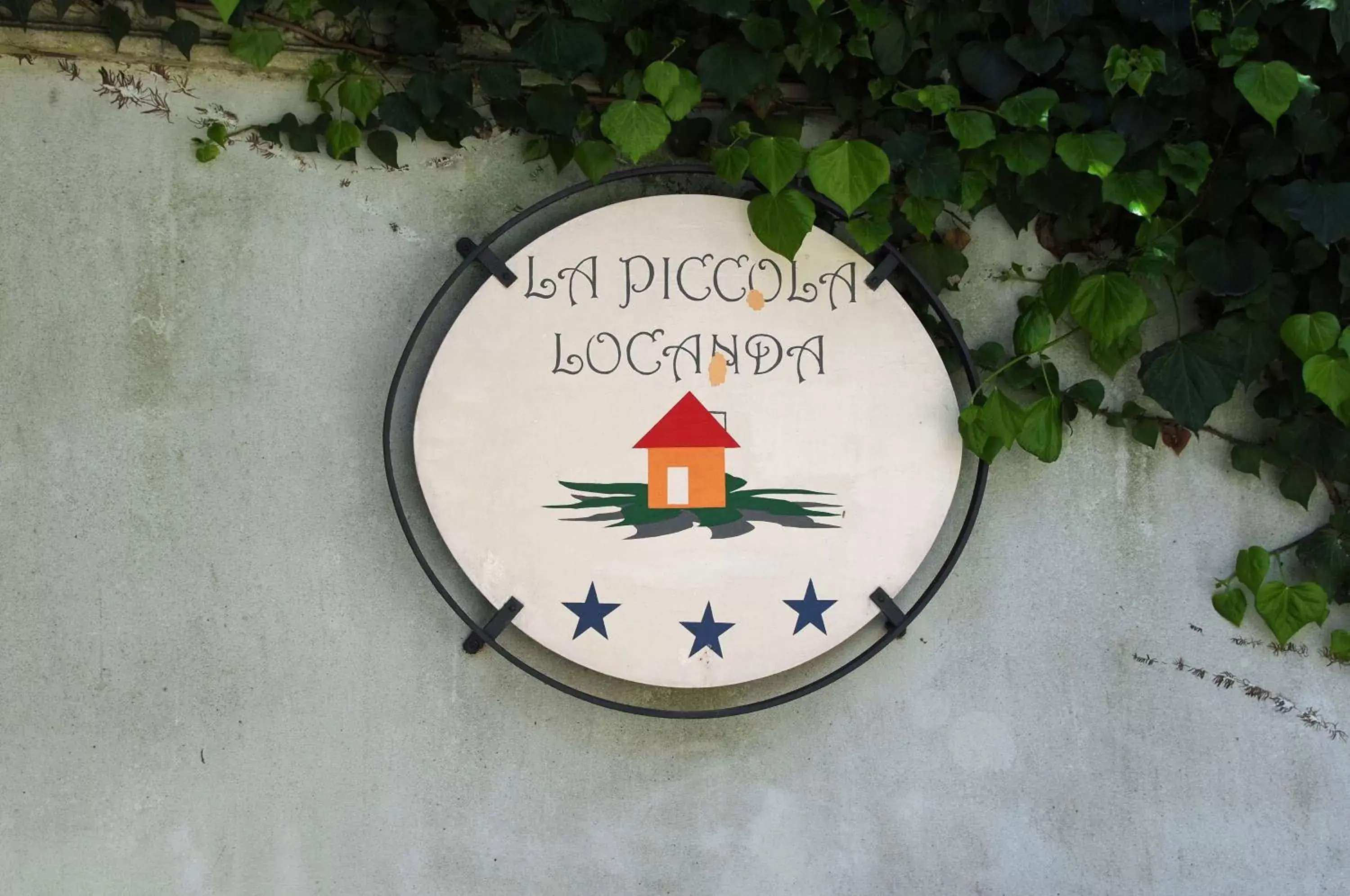 Property logo or sign in La Piccola Locanda